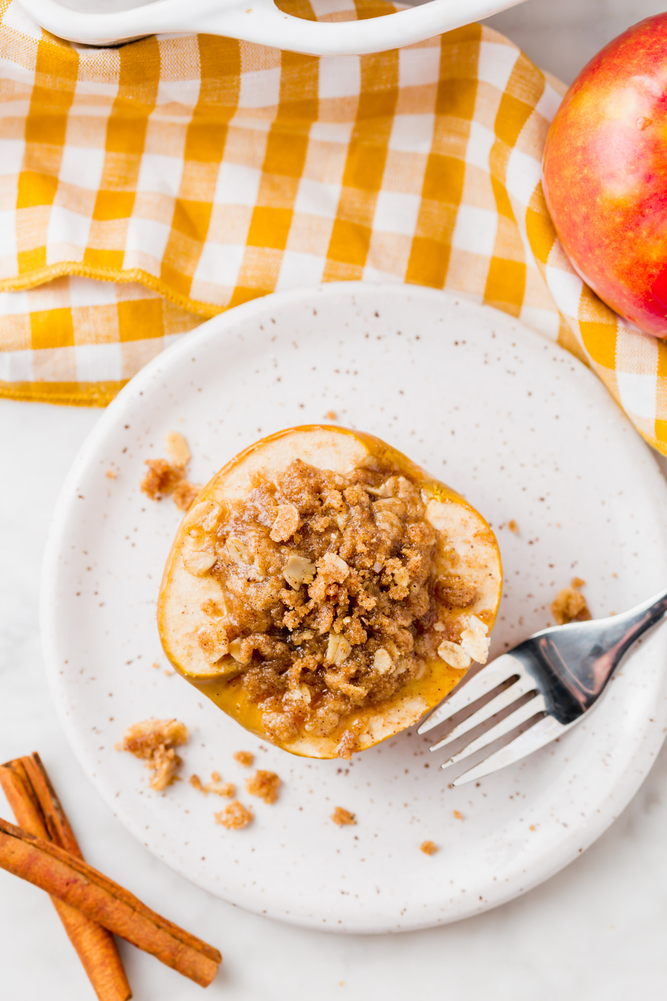 An overhead photo of baked apple with gluten-free streusel.