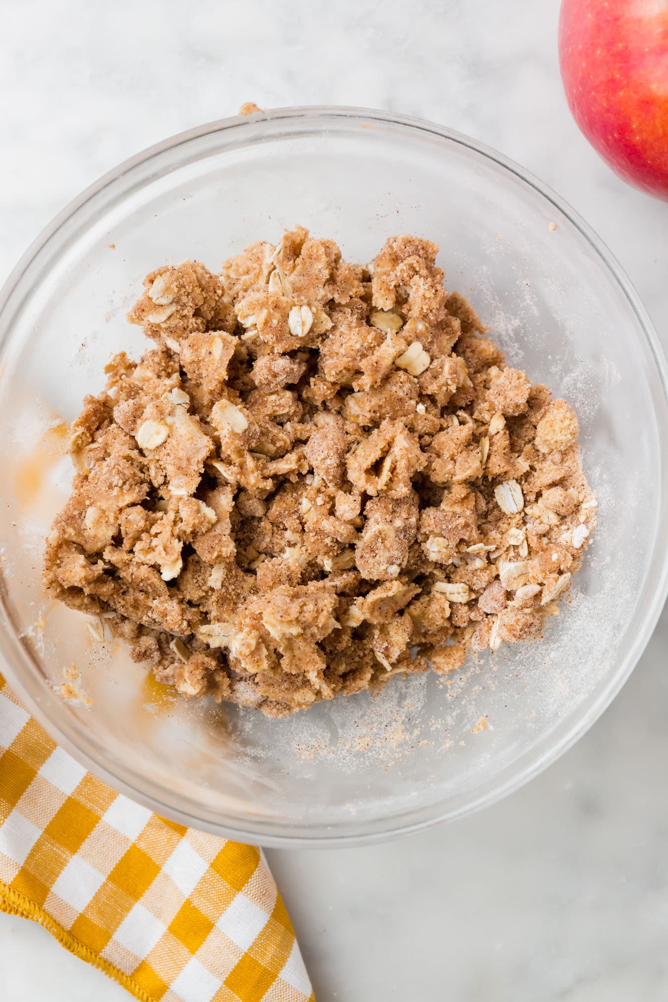 A bowl of gluten-free streusel mixed together.