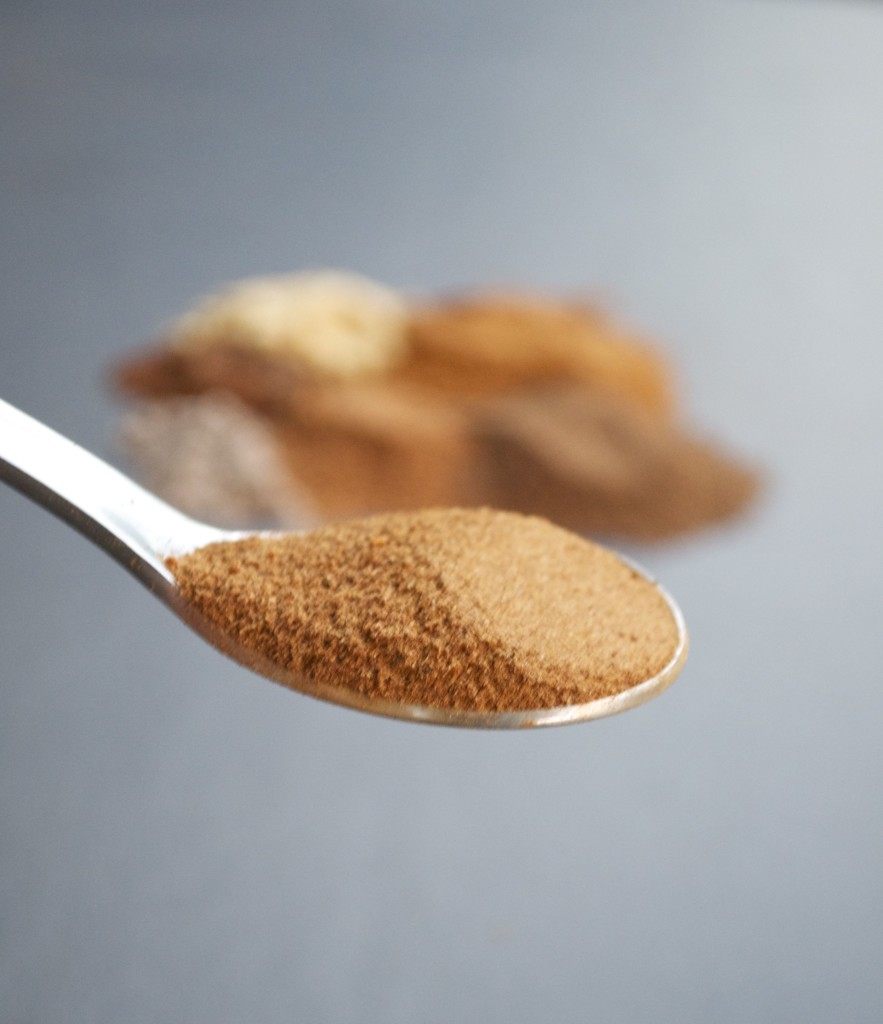 A spoon of pumpkin pie spice mix.