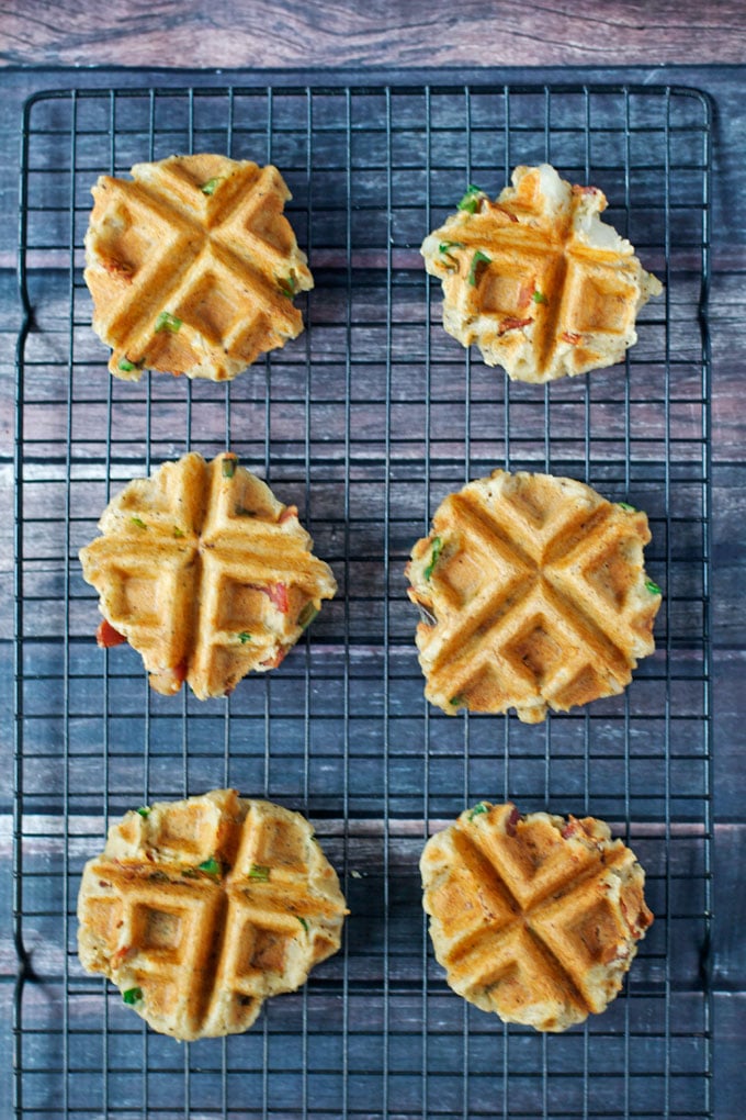 Mashed potato waffles on a cooling rack.