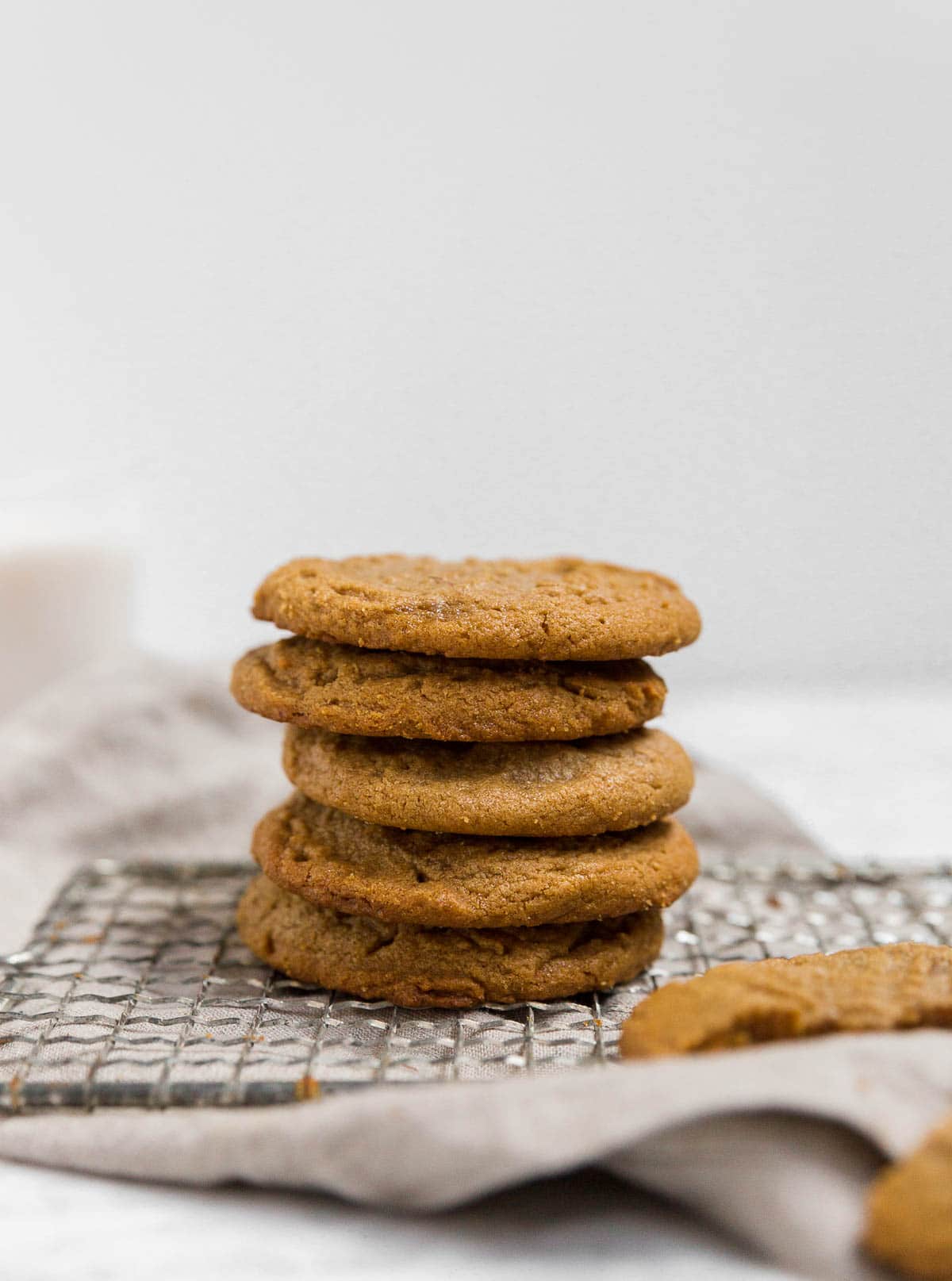 A straight on shot of a stack of flourless peanut butter cookies.