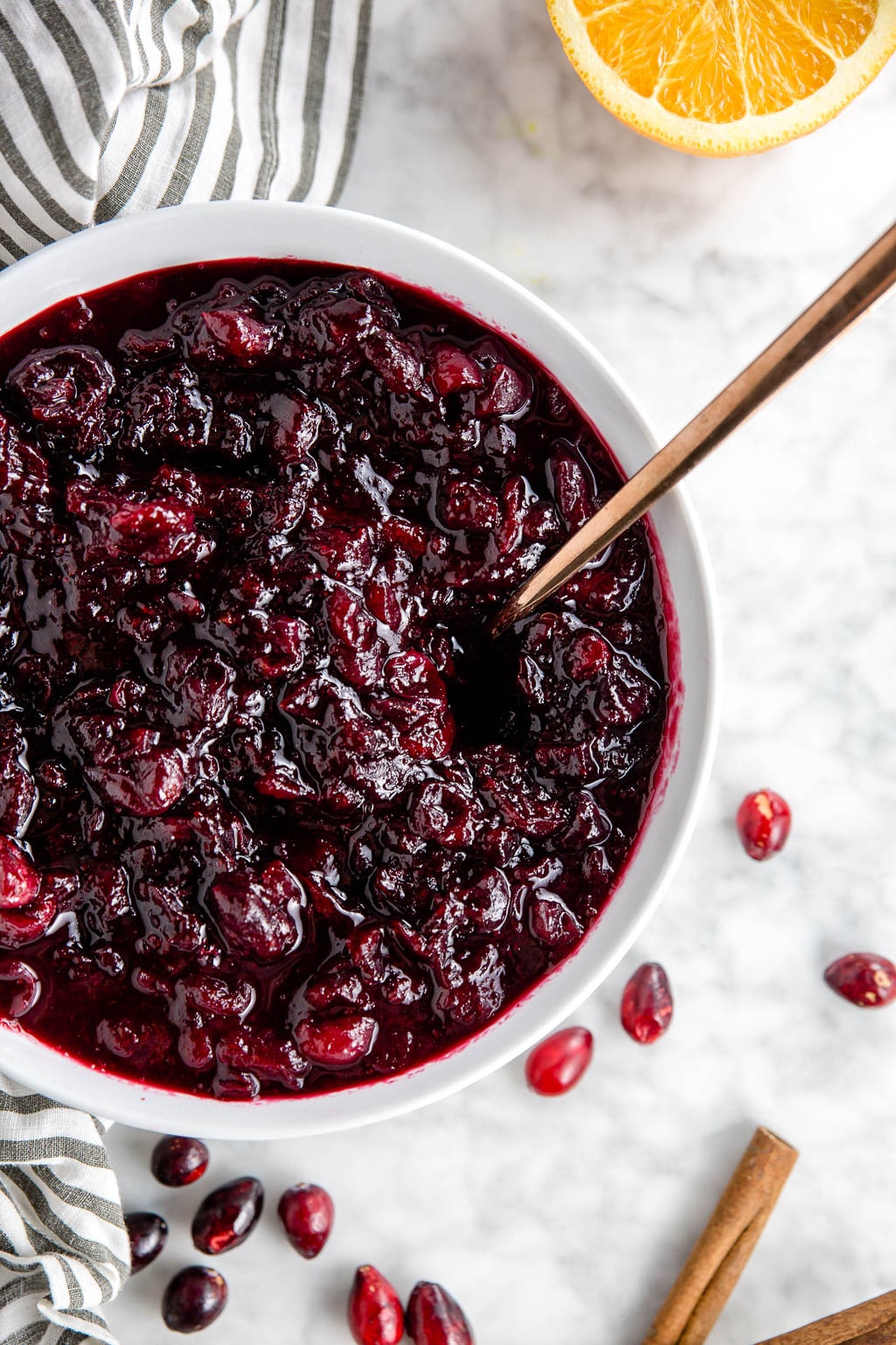 A big bowl of red wine cranberry sauce with orange juice.