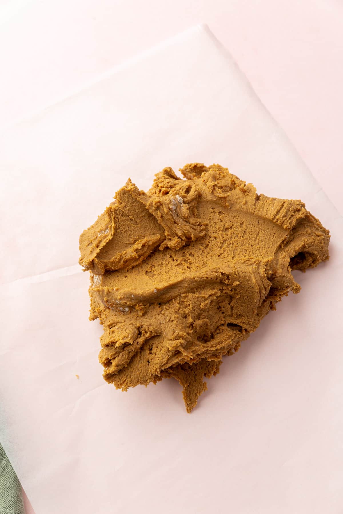 Gluten-free gingerbread cookie dough on a piece of parchment paper before chilling in the refrigerator.