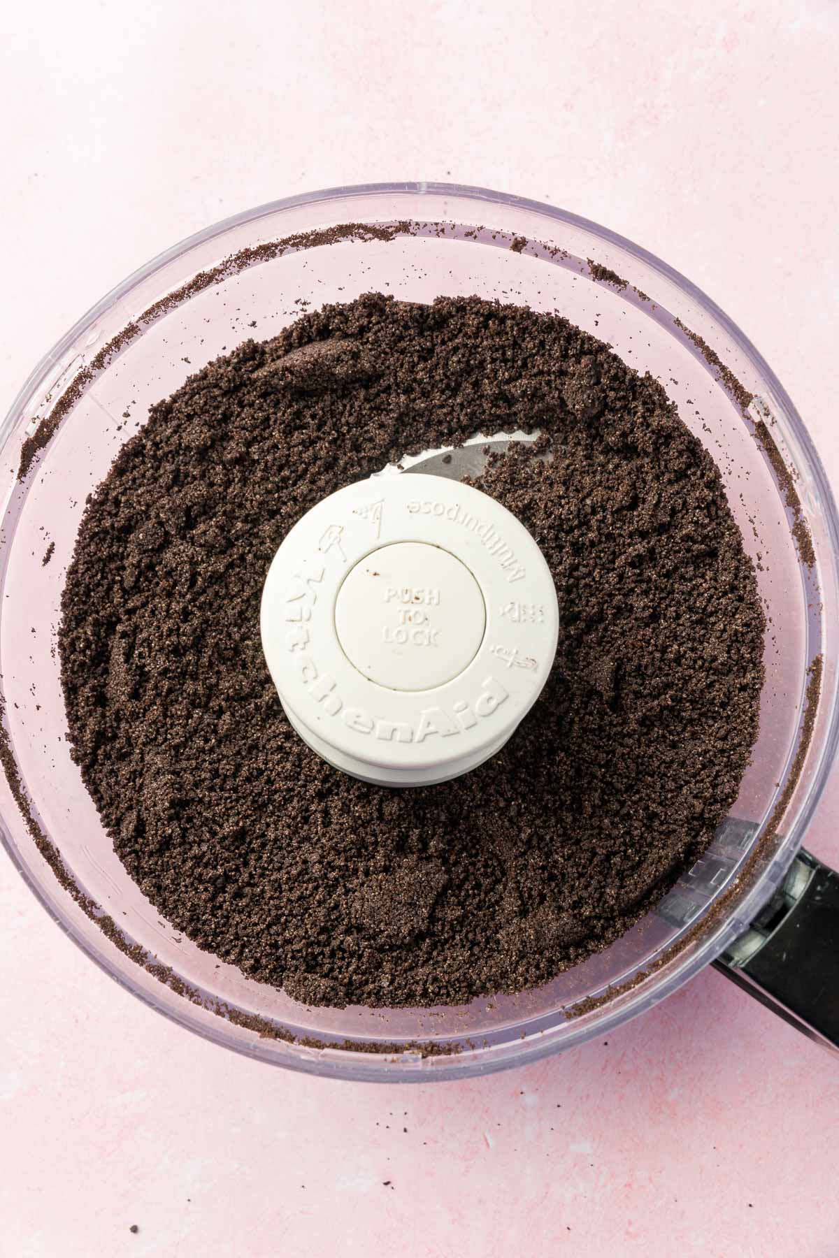 Gluten-free Oreo crumbs in a food processor after pulsing until finely ground.