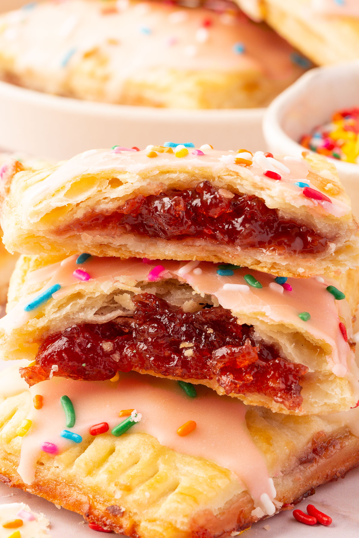 Close up image of gluten-free pop tarts broken in half, with the filling clearly shown.