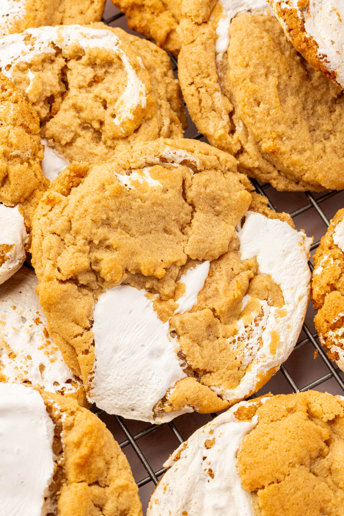 Close up image of gluten-free fluffernutter cookies on a cooling rack.