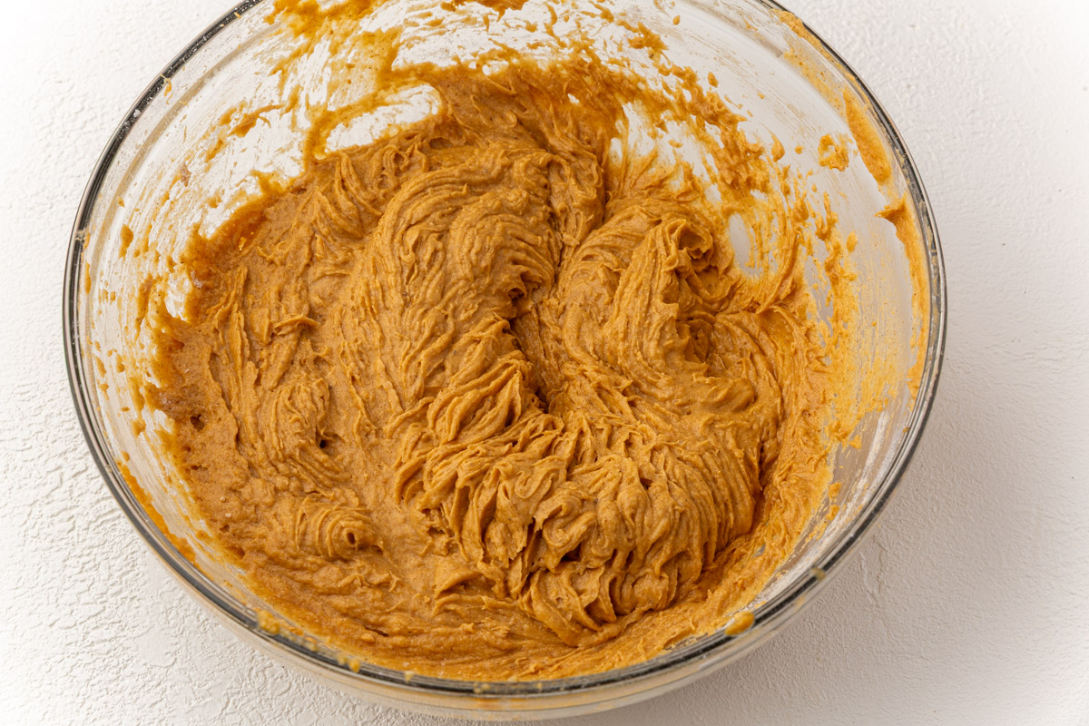 Thick pumpkin coffee cake batter fully mixed and ready to be spread into the pan.