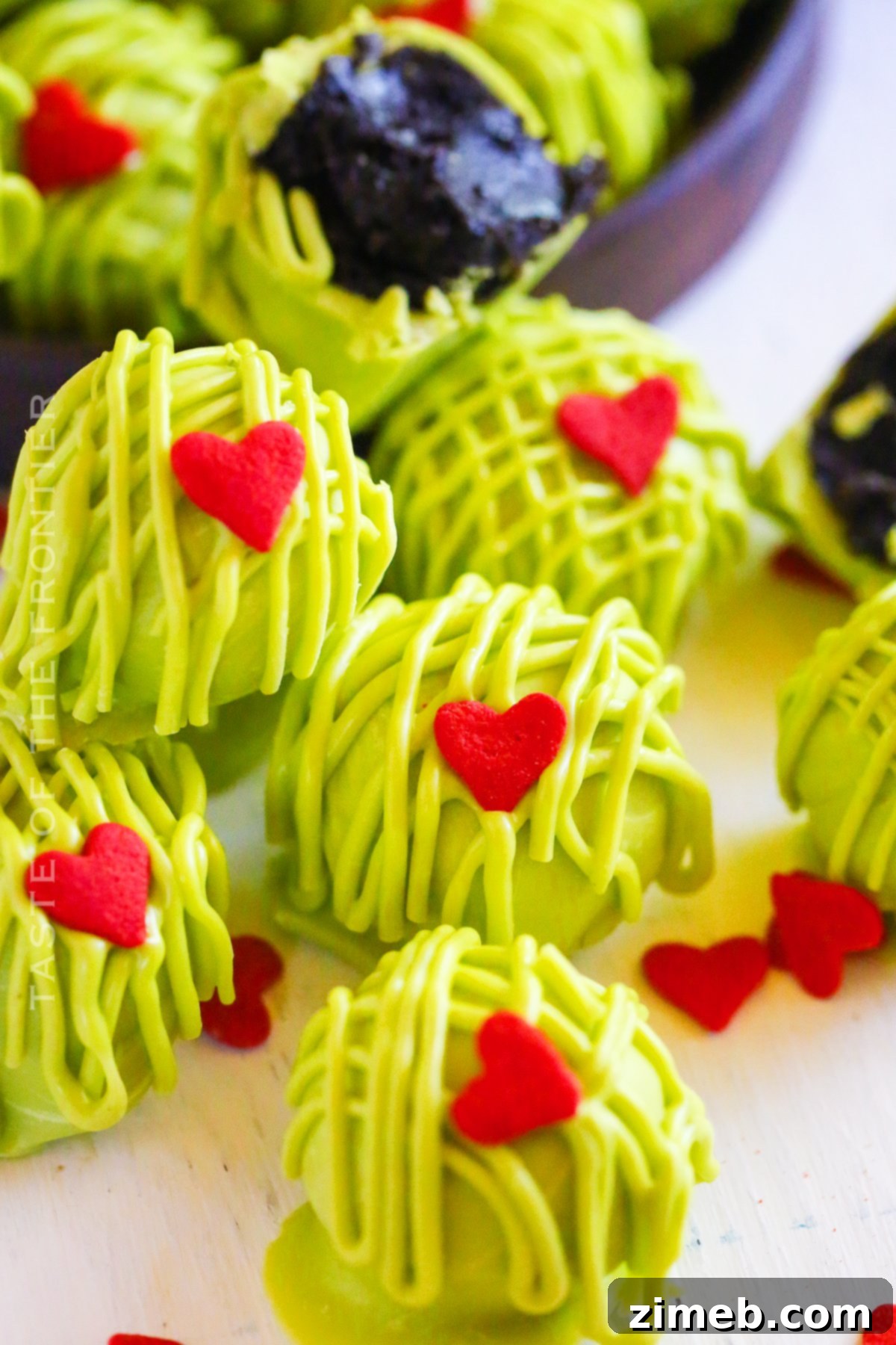 Bright Green Grinch Truffles with Red Hearts