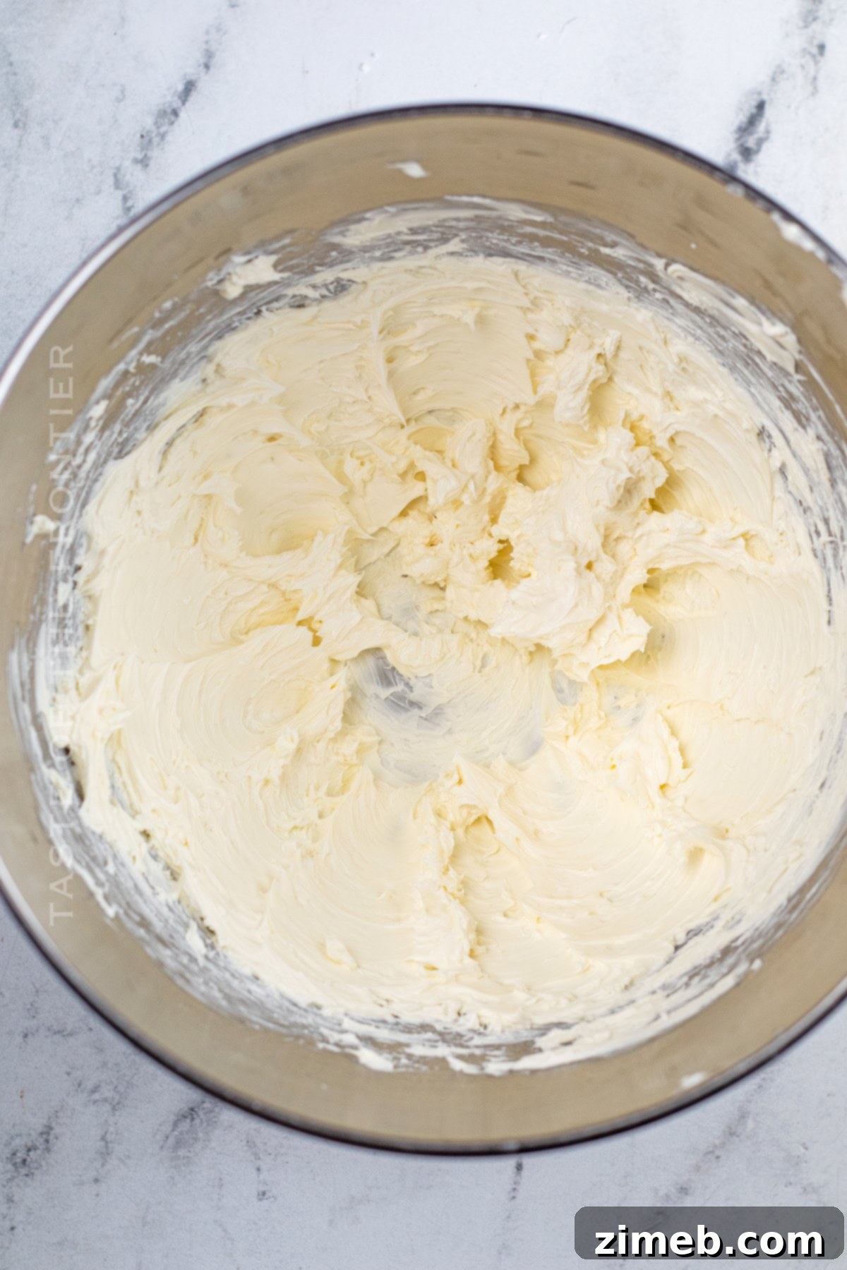 beating the cream cheese