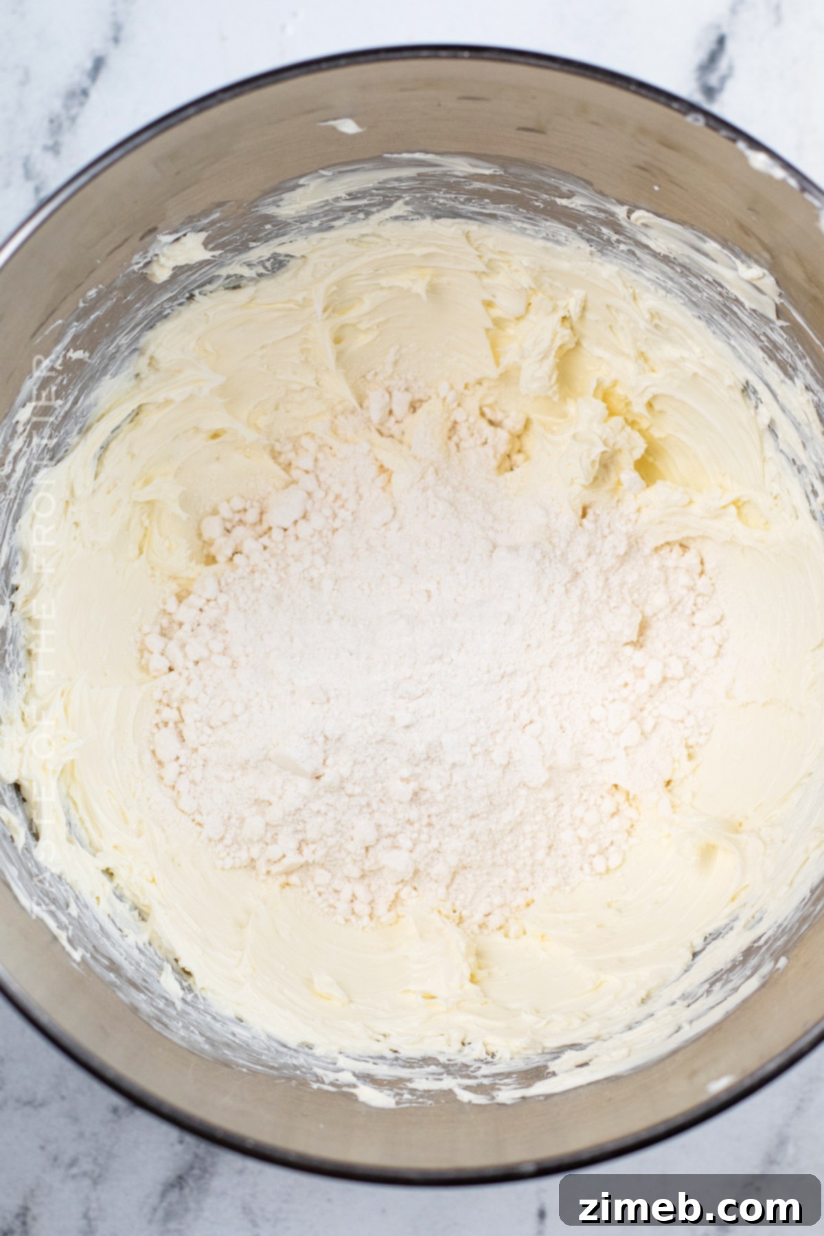 adding the cake mix