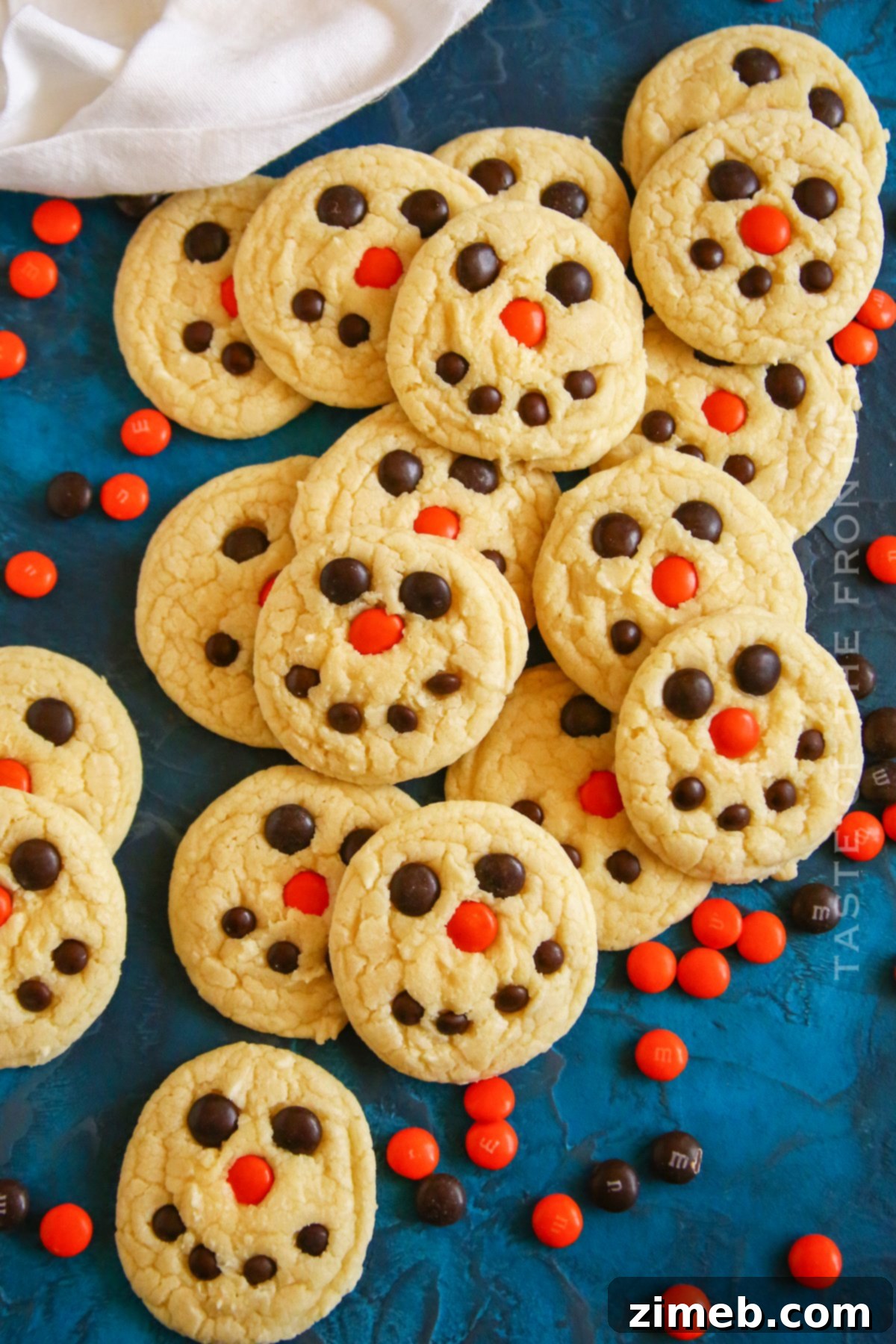 Festive Snowman Cookies 2 Snowman Cake Mix Cookies, decorated with M&Ms for eyes and mouth.