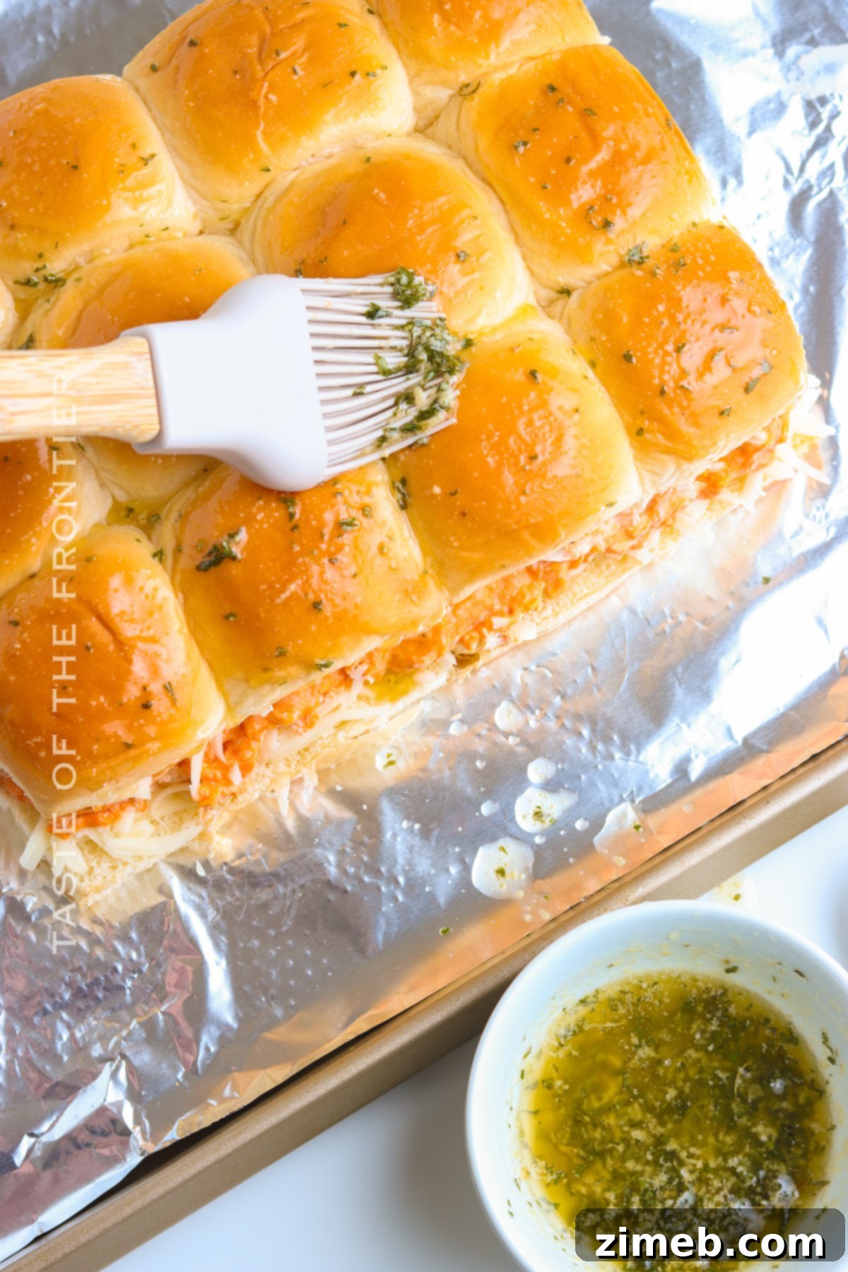 adding butter and herb topping