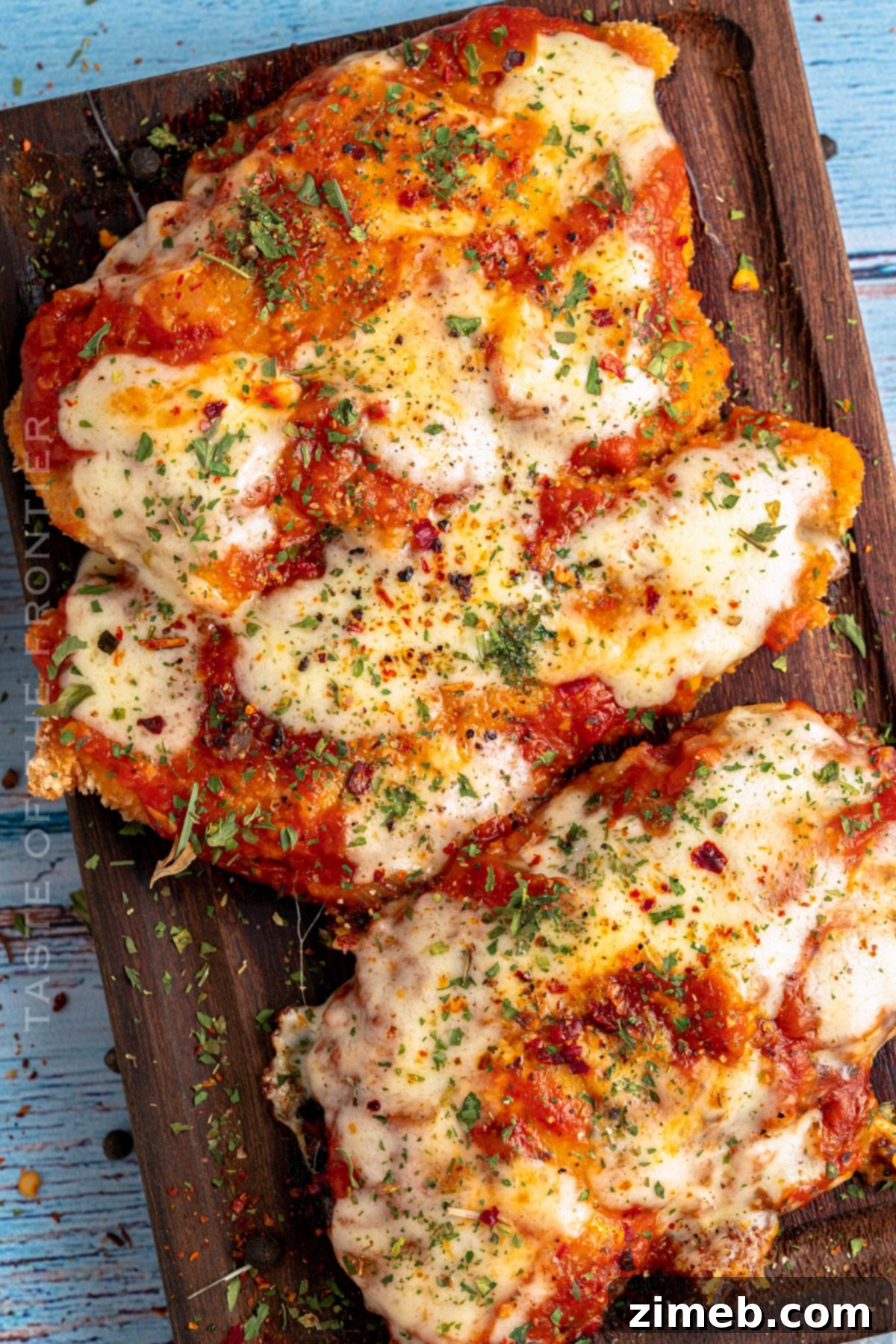 Close-up of a chicken parm recipe, showing melted cheese and sauce.