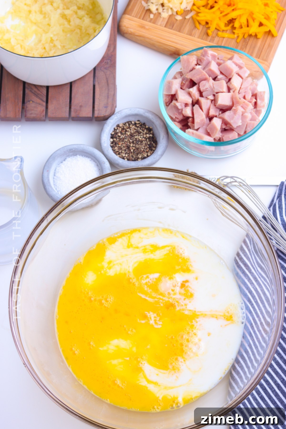 Golden Ham & Gruyere Quiche 6 mixing eggs for ham and cheese quiche