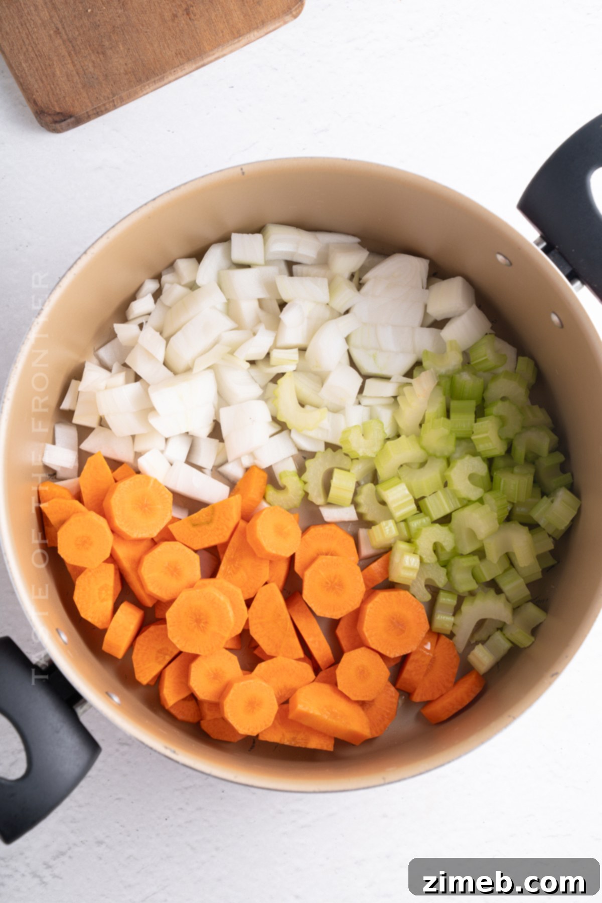 Hearty Chicken Noodle Comfort 5 Step-by-step process of making chicken noodle soup: sautéing vegetables, adding broth, and simmering.