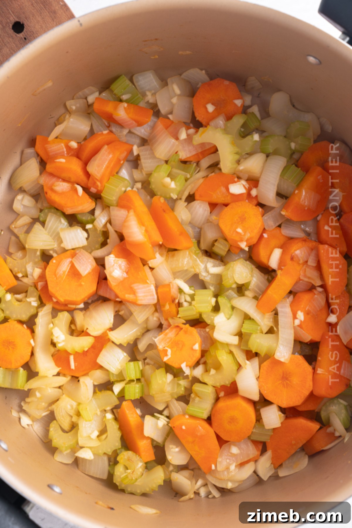 Hearty Chicken Noodle Comfort 6 A large pot of chicken noodle soup simmering on the stovetop, demonstrating the cooking process.