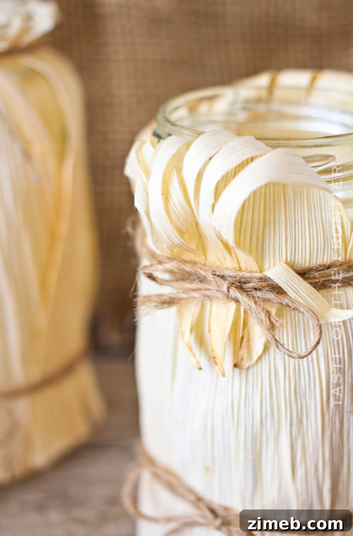 Close-up of jars wrapped with natural corn husks, ready for illumination