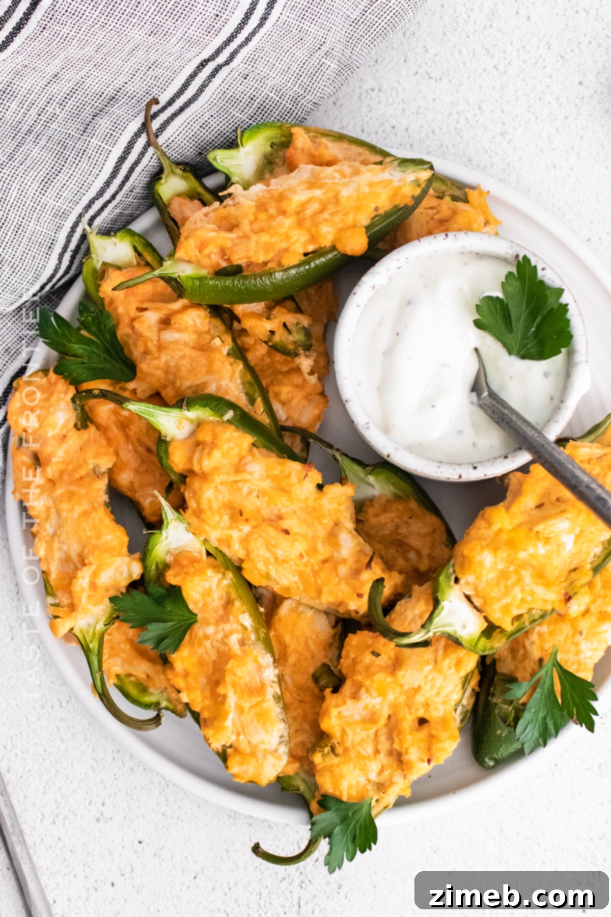 Game day snack featuring buffalo chicken filled jalapeno poppers
