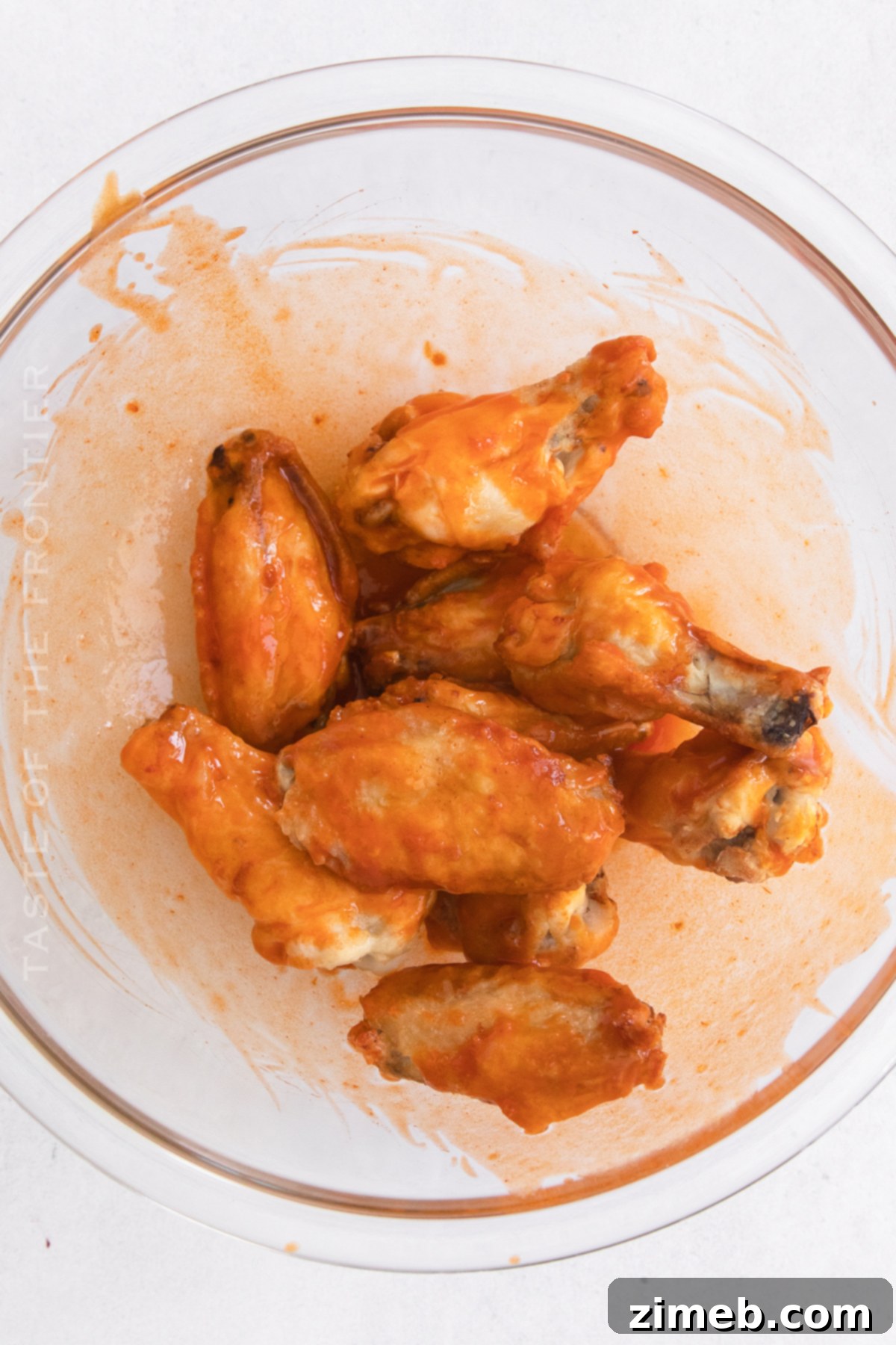 Sticky Honey-Glazed Chicken Wings 9 Tossing air fried chicken wings in honey buffalo sauce