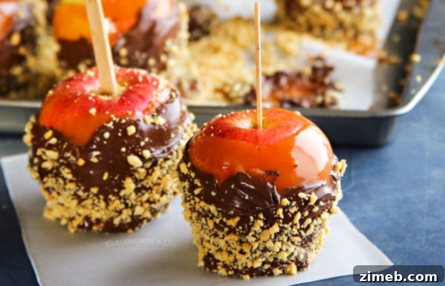 Homemade Caramel Apples coated in chocolate and peanuts, reminiscent of a nostalgic fudge shop treat