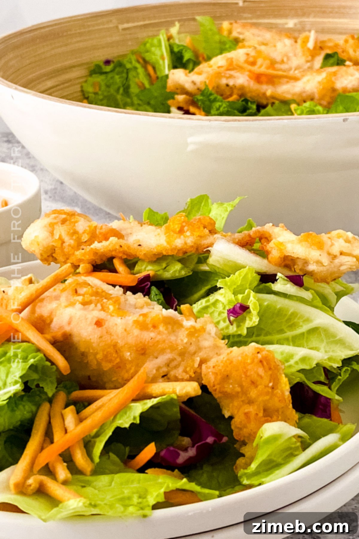 A large bowl of delicious Oriental Chicken Salad ready for dinner.