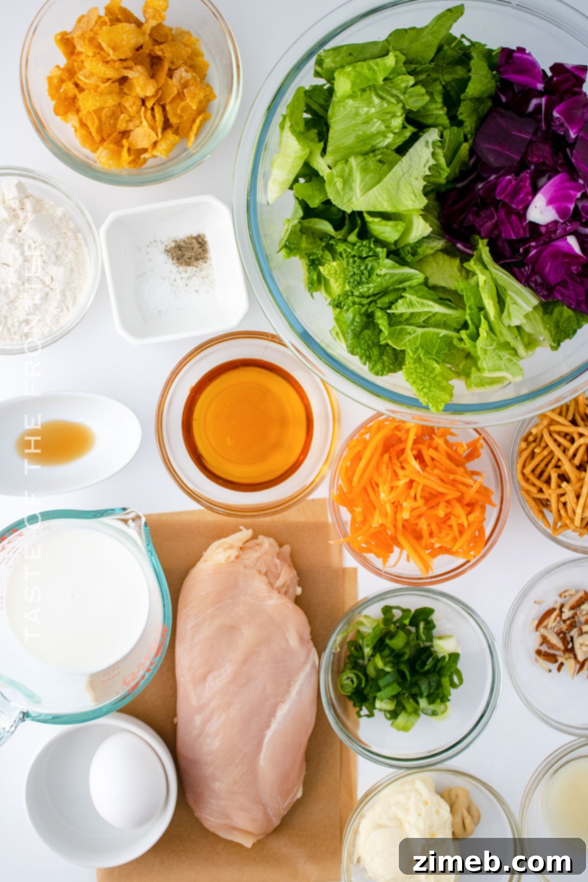 All the fresh ingredients laid out to make the homemade Oriental Chicken Salad dressing, chicken, and salad components.