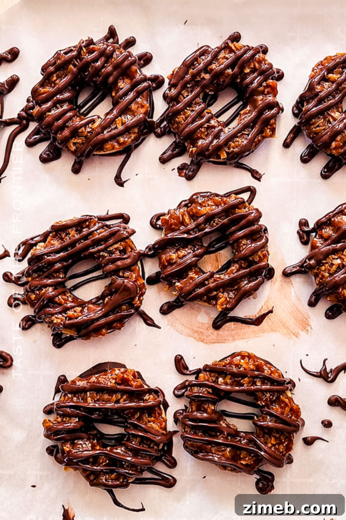 Close-up of freshly decorated homemade Samoas with chocolate drizzle
