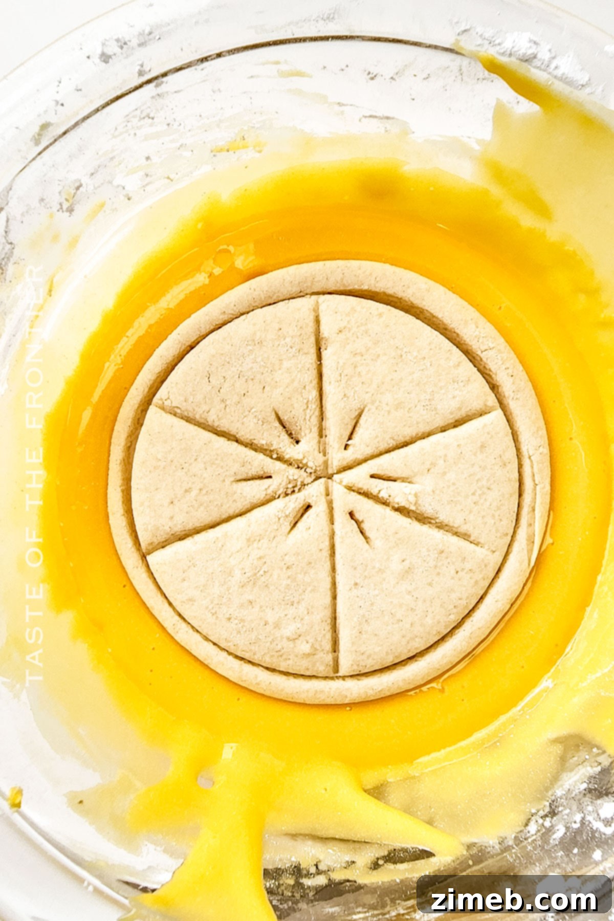Copycat Girl Scout Lemonades Cookies 8 Dipping the homemade lemon cookies in glaze