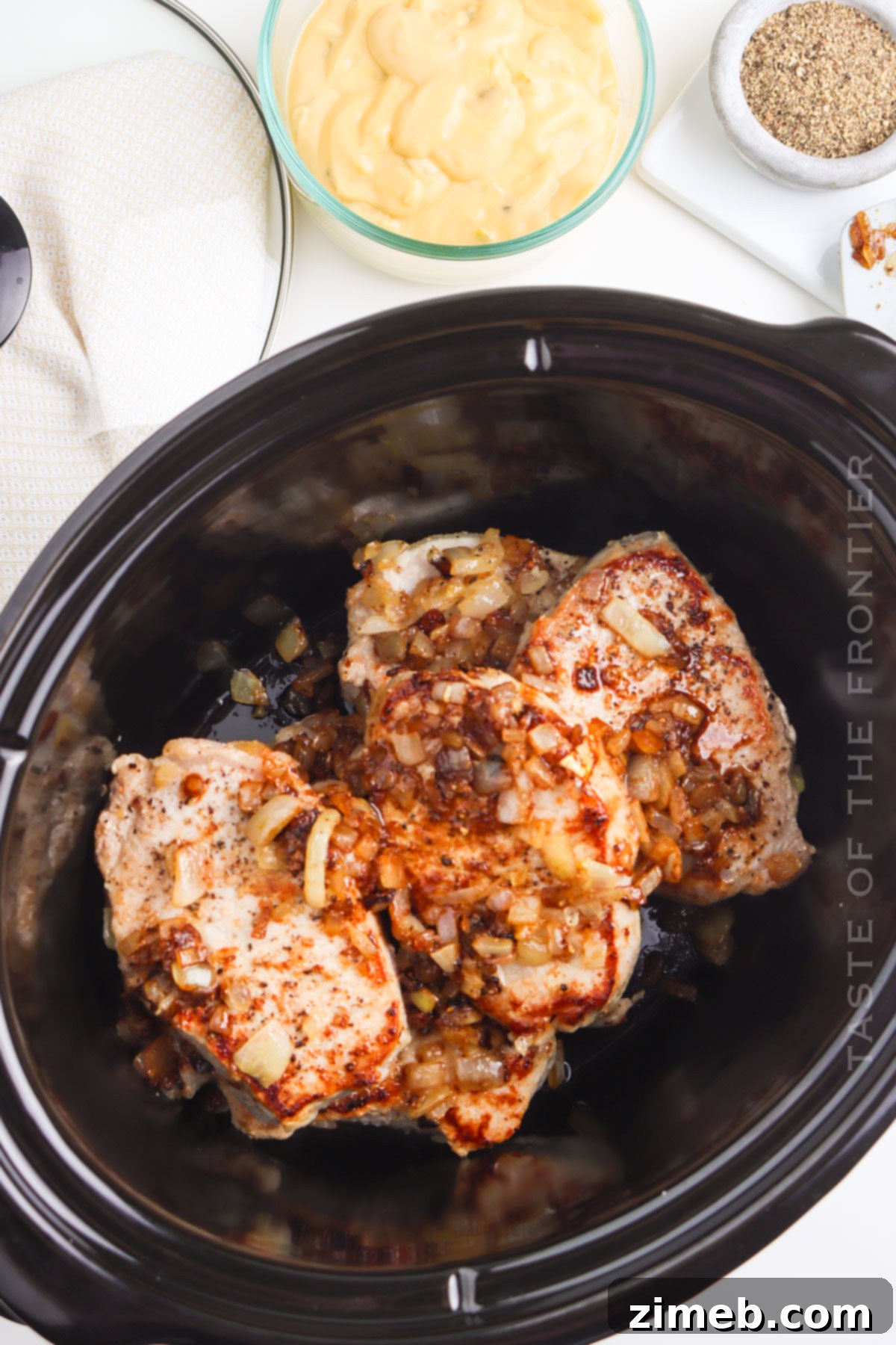 Melt-in-Your-Mouth Slow Cooker Pork Chops 6 cooked and added to the crock pot
