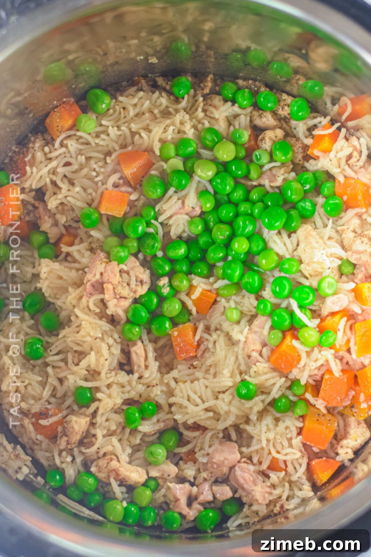 Easy Instant Pot Chicken and Rice 8 Mixing the ingredients for Instant Pot Chicken and Rice.