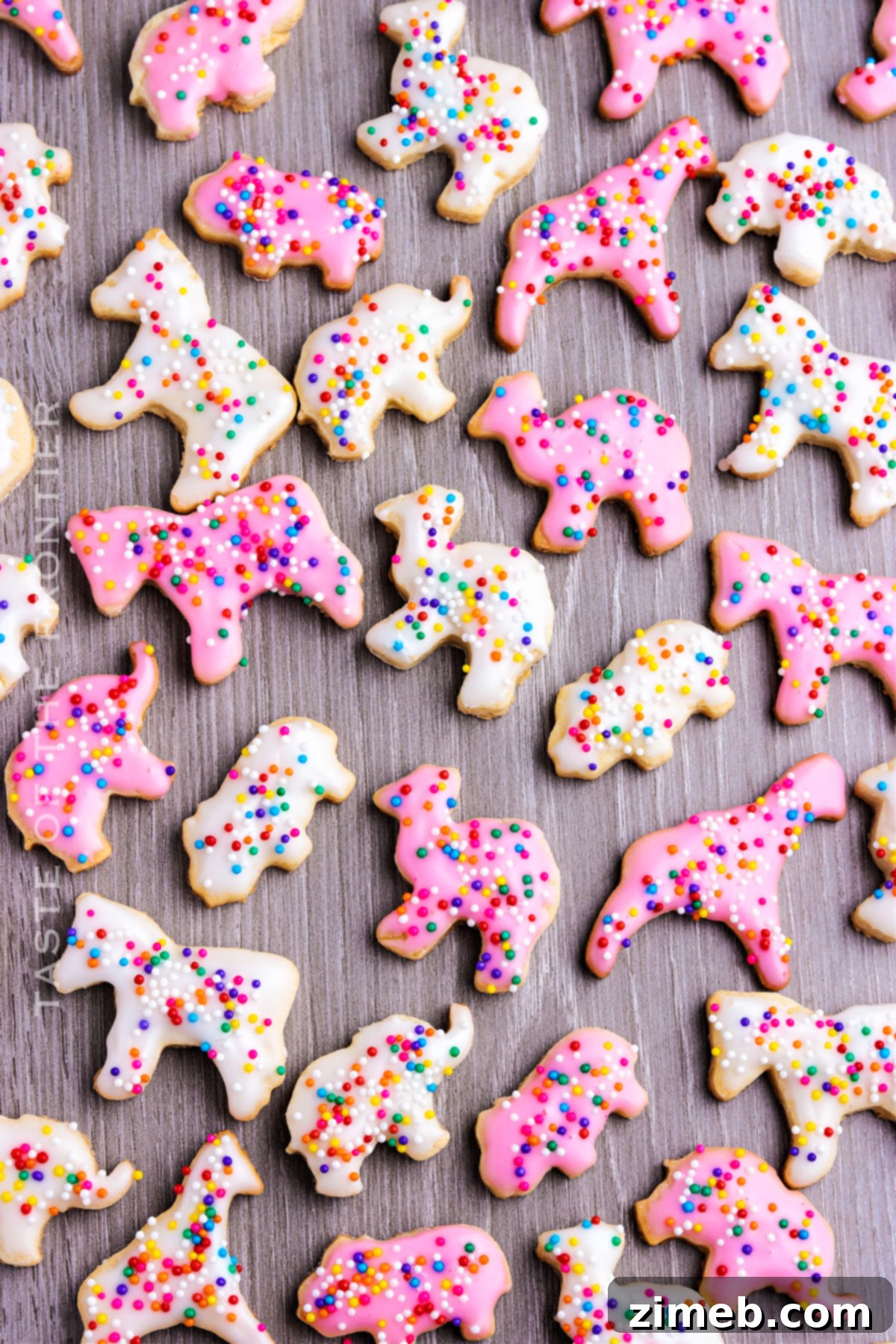 Whimsical Frosted Animal Treats 2 Copycat Frosted Animal Cookies Recipe - Delicious homemade vanilla cookies topped with pink and white glaze and rainbow sprinkles.