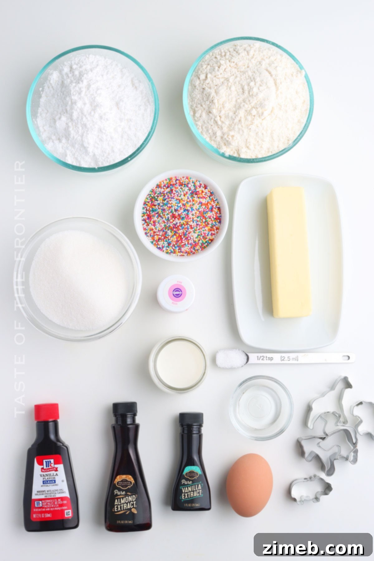 Whimsical Frosted Animal Treats 4 Ingredients for homemade copycat frosted animal cookies laid out on a table.