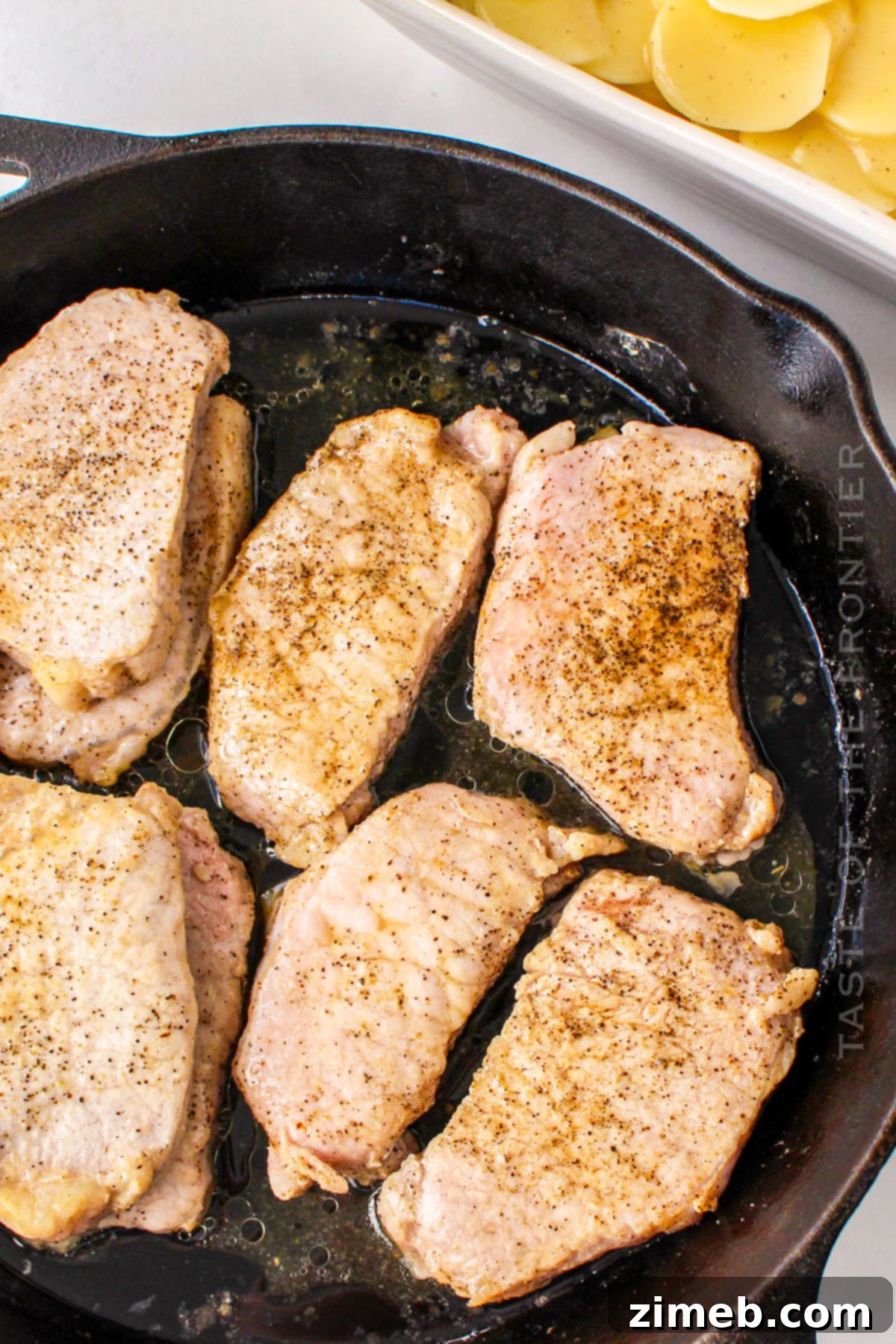 Hearty Pork Chops with Creamy Scalloped Potatoes 5 browning the chops
