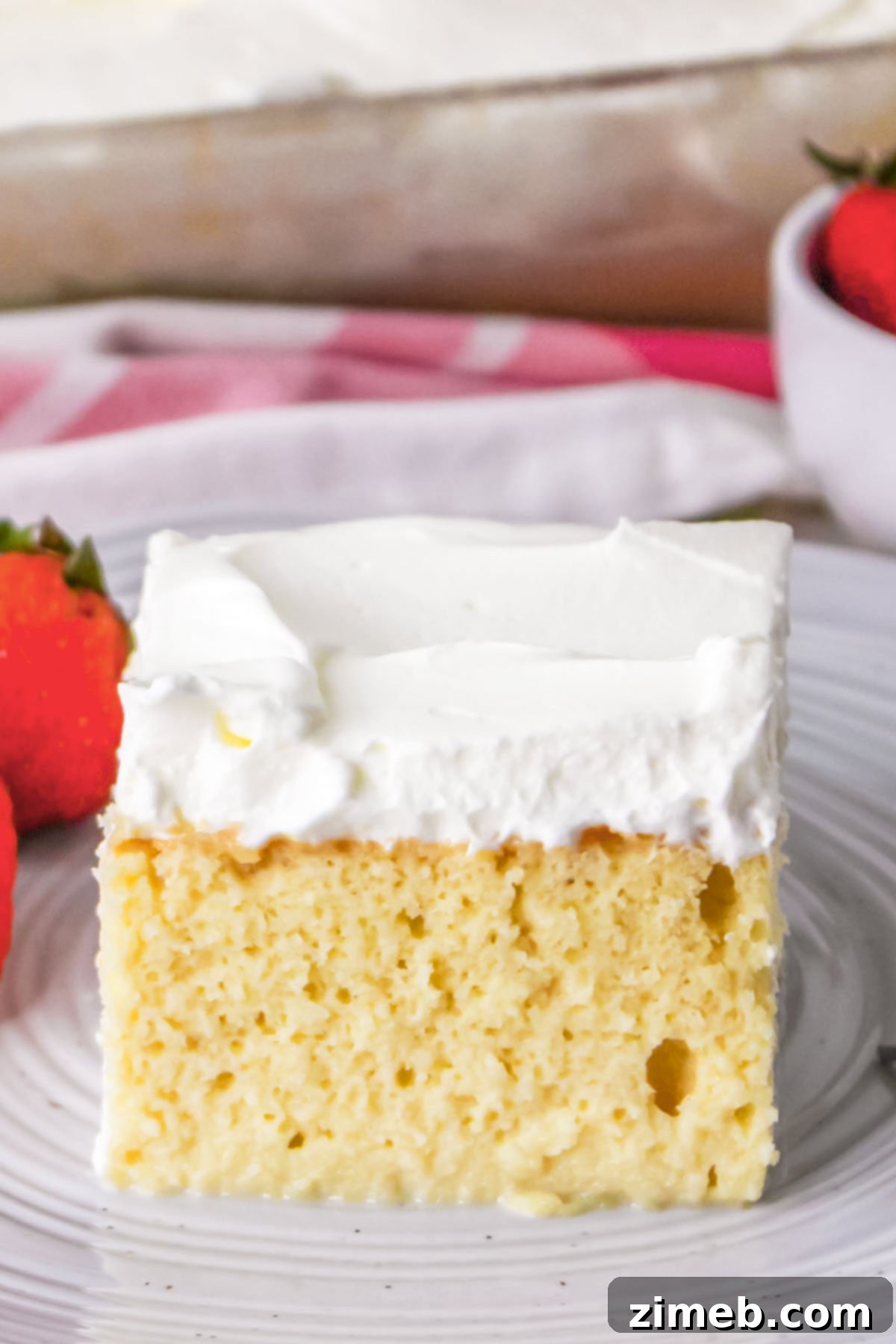 A full Tres Leches Cake, beautifully garnished and ready to serve.