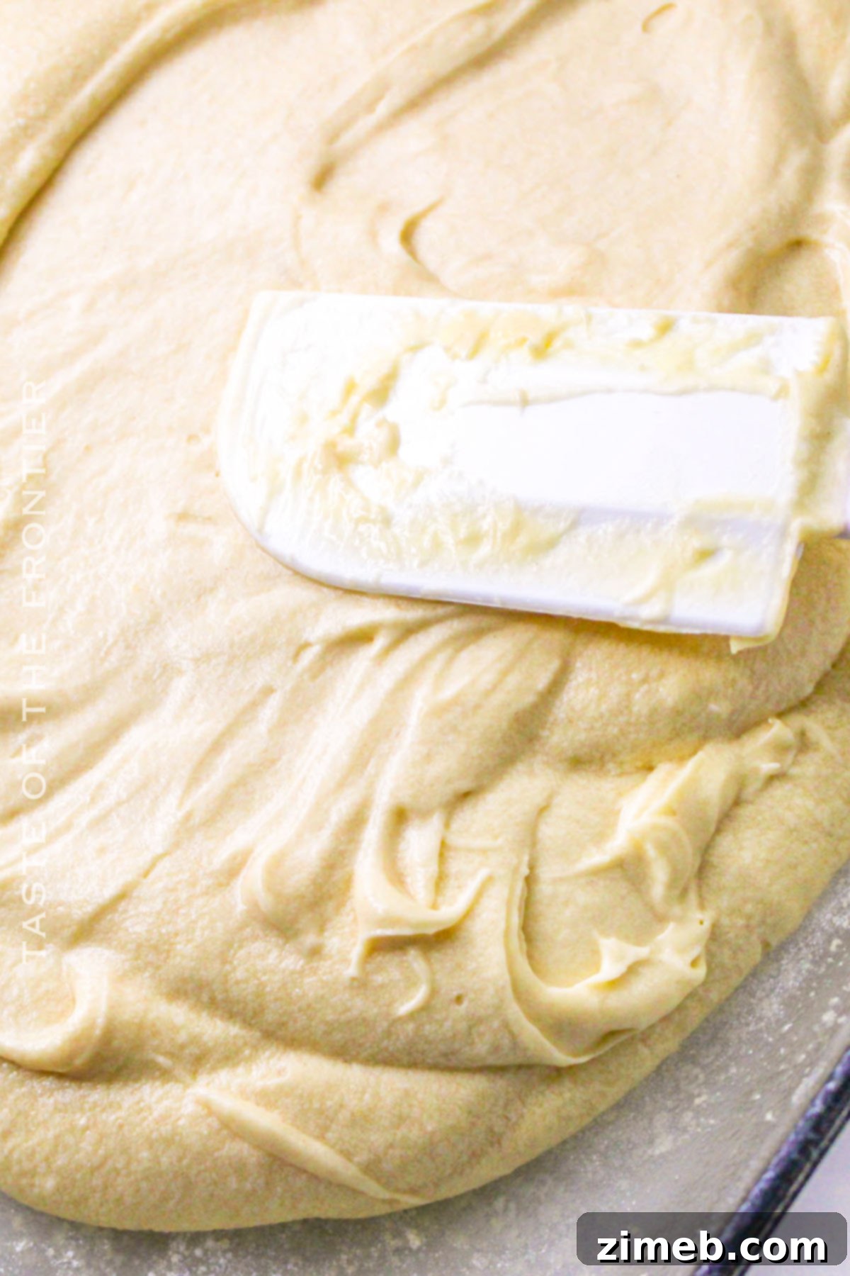 Tres Leches Cake batter in a mixing bowl, ready for baking.