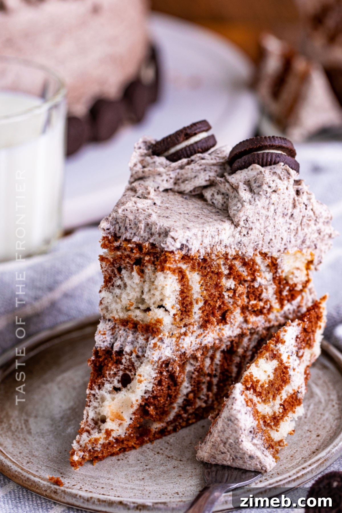 Monochrome Ripple Cake 15 A delicious bite of Zebra Cake with frosting.
