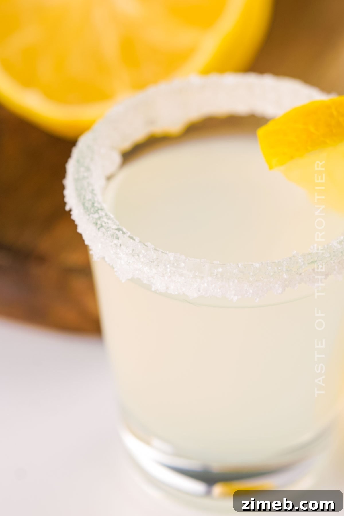An inviting close-up of a single easy lemon shot with a sugared rim, perfectly prepared.