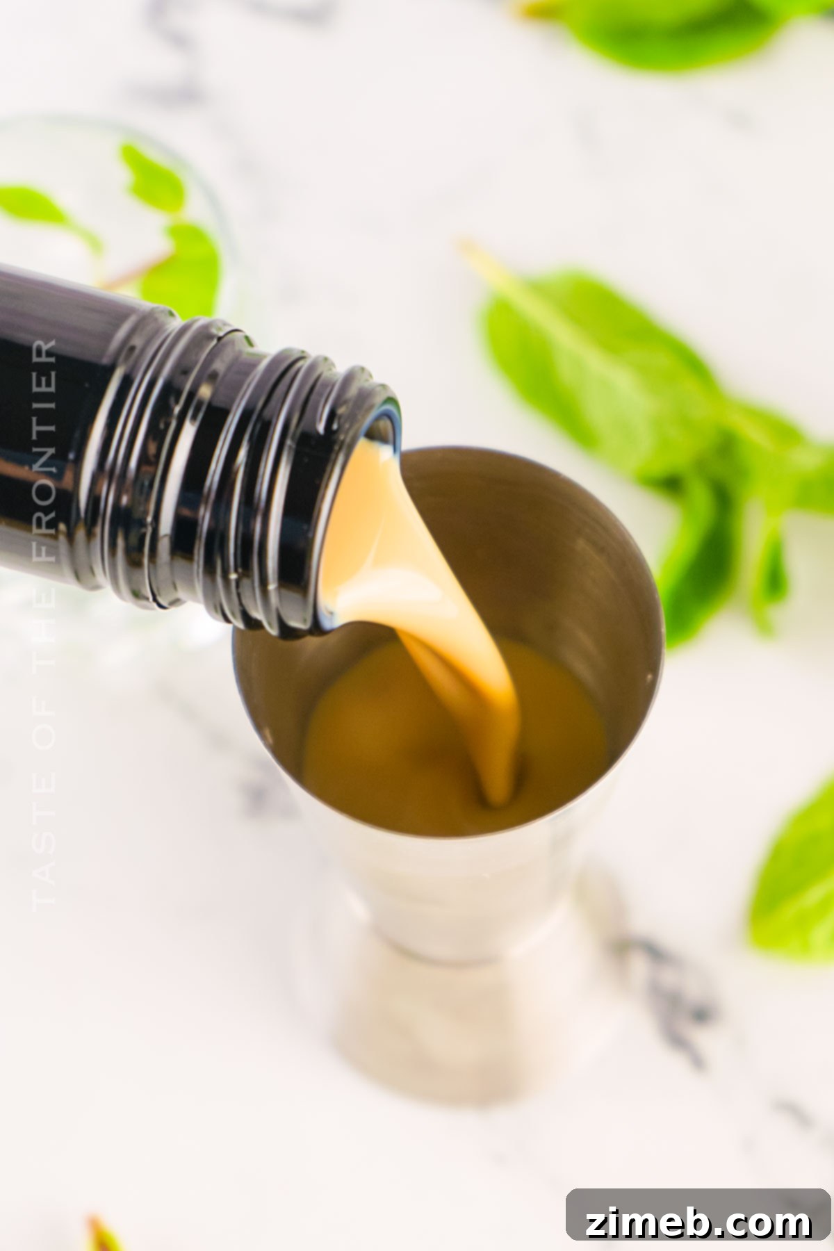 Midnight Thin Mint Shooters 7 A bottle of creamy Irish cream liqueur, a core ingredient for Dirty Girl Scout Shots.