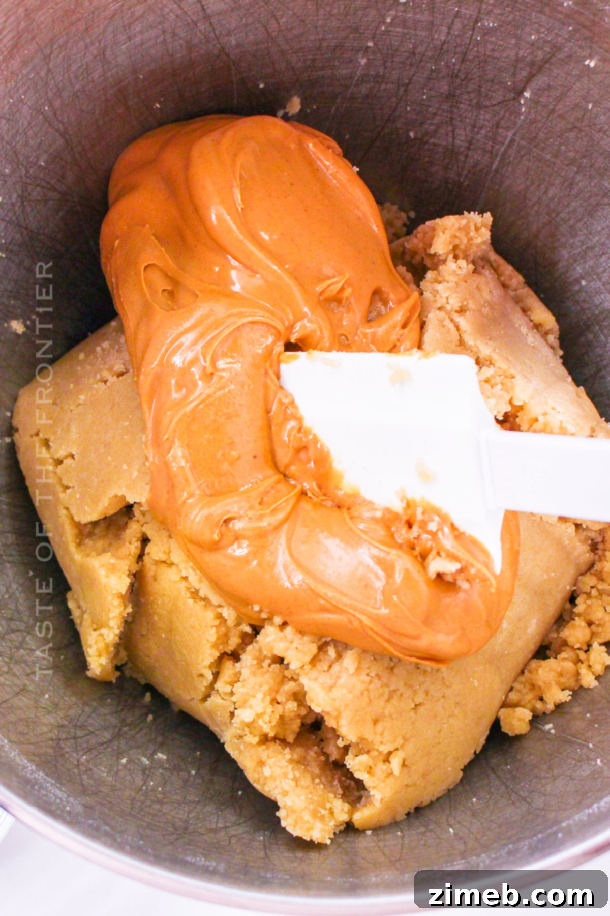 Double Peanut Butter Delight Cupcakes 5 Adding creamy peanut butter to cupcake batter