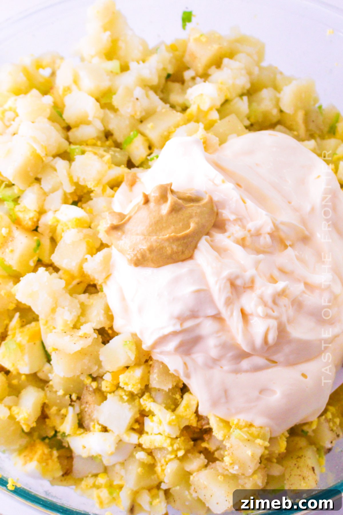 mixing the potatoes and sauce
