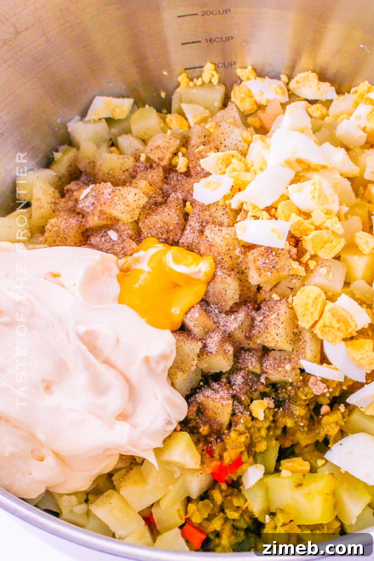 Grandma's Southern Potato Salad 7 Adding seasonings to the warm potatoes for Southern potato salad.