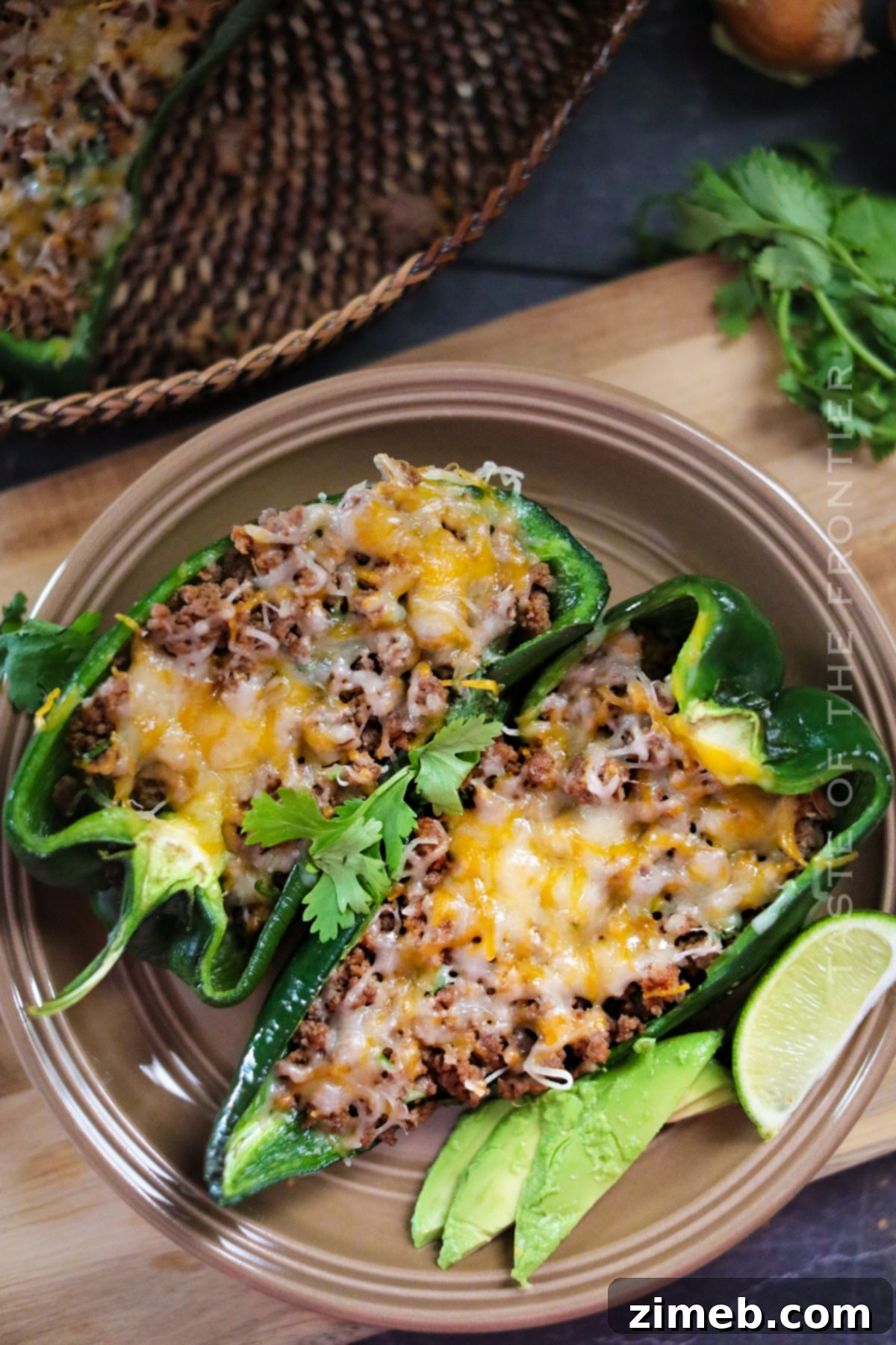 Close-up of baked stuffed poblano peppers with melted cheese