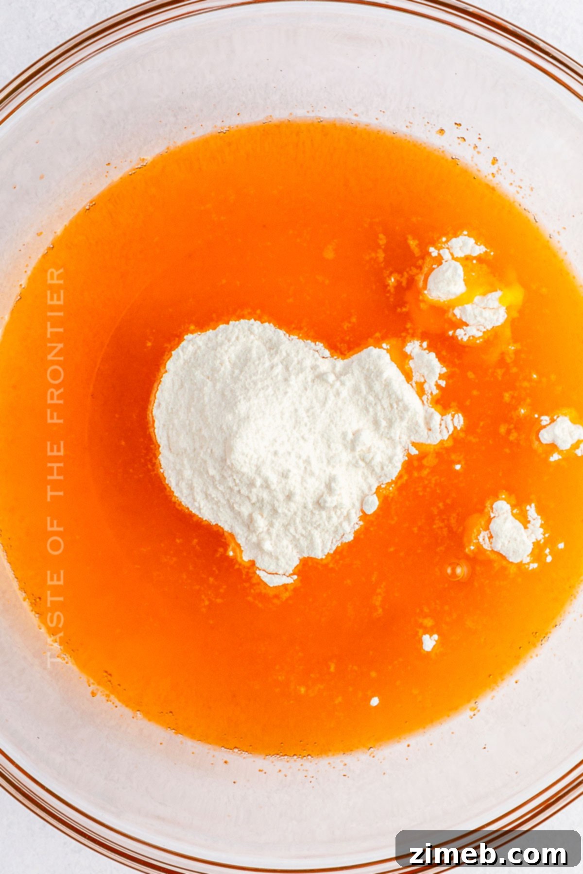 Citrus Cloud Delight 5 Adding Pudding Mix to Orange Fluff Salad