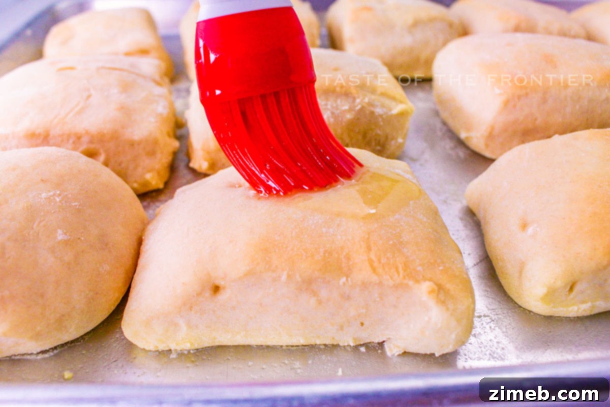 Homemade Texas Roadhouse Rolls 7 buttered rolls - Warm, golden-brown rolls brushed with melted butter.