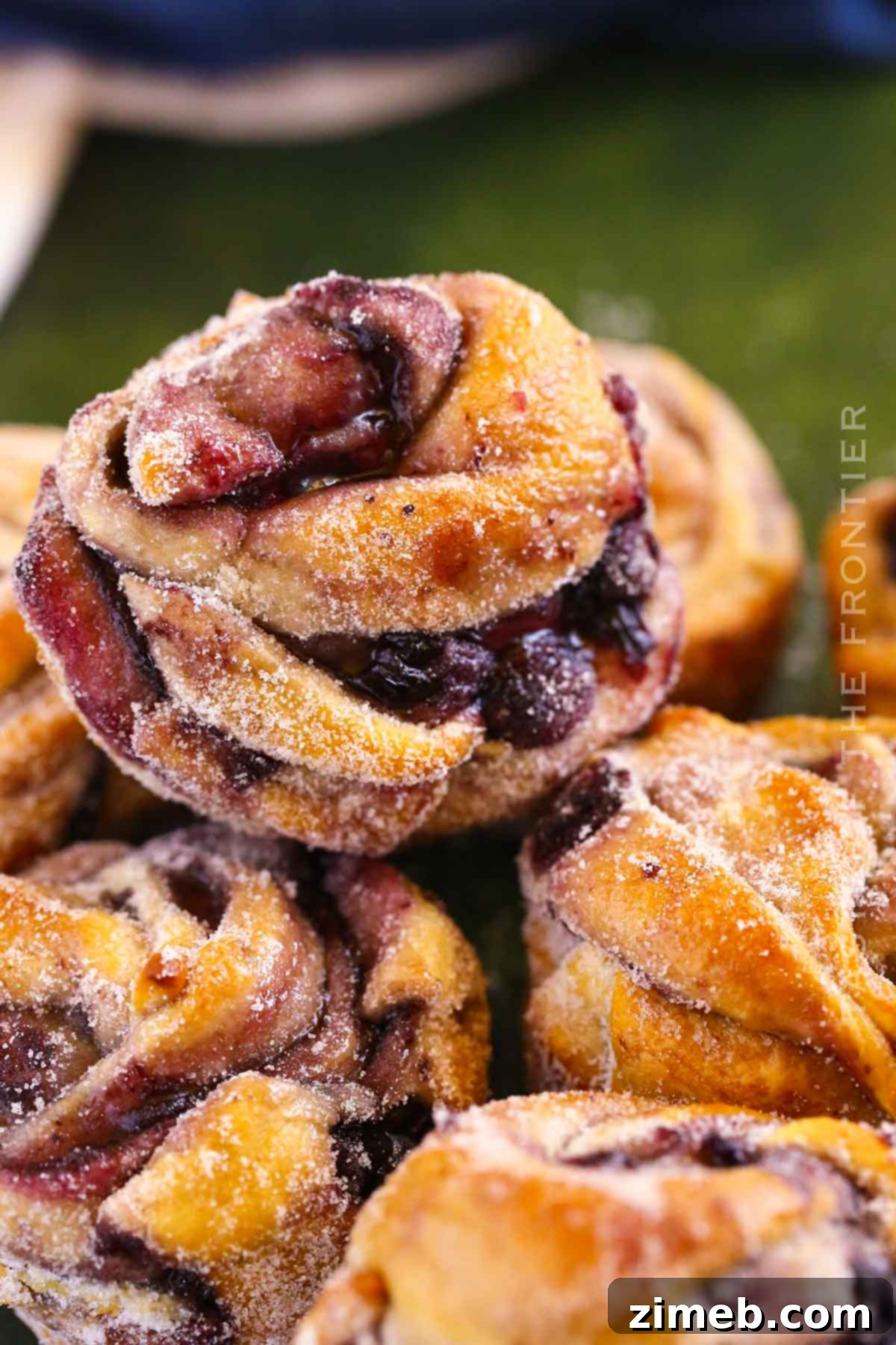 Blueberry Bliss Cruffins 2 Blueberry Cruffins, a delicious pastry combining croissant and muffin with blueberry filling.