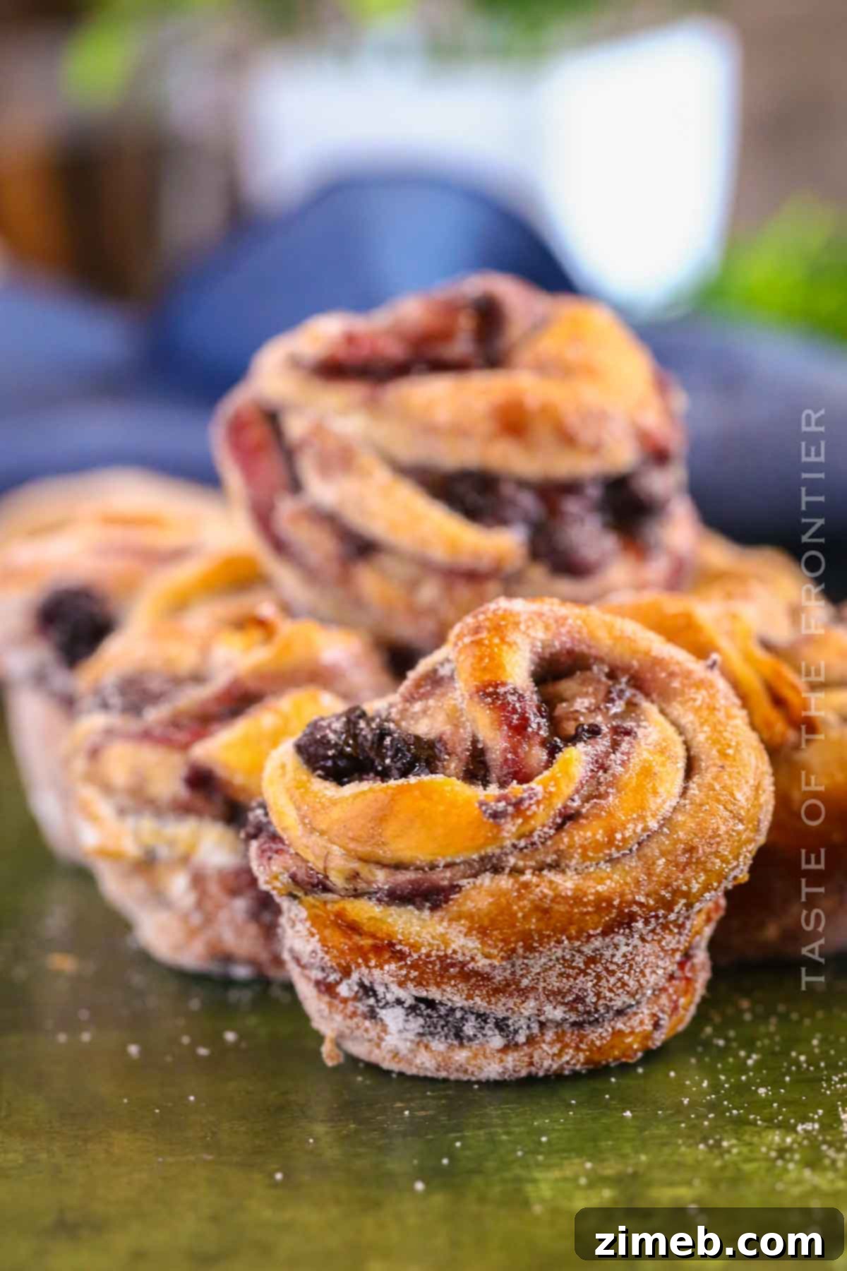 Blueberry Bliss Cruffins 9 A baked Blueberry Cruffin, highlighting its flaky layers and sugary coating.