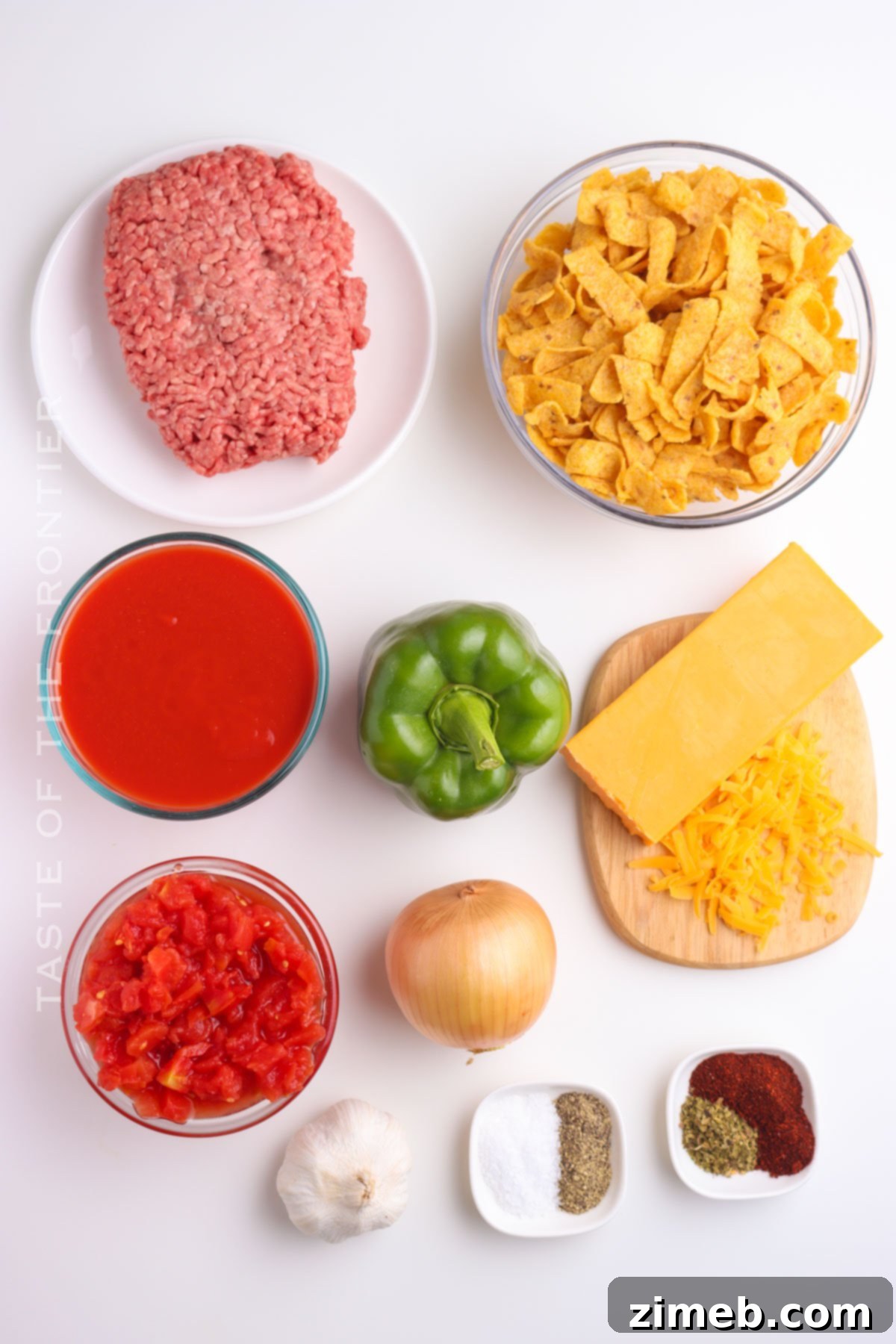 Chili Chip Comfort Bowl 4 Ingredients laid out for making Frito Chili Pie, including ground beef, vegetables, spices, and Fritos