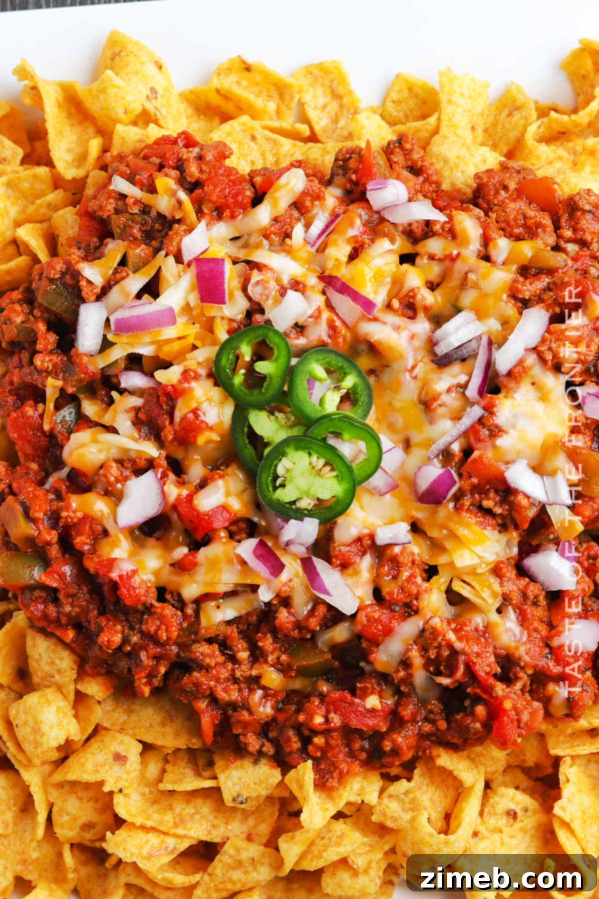 Chili Chip Comfort Bowl 9 Individual serving of Frito chips with nacho-style beef chili, garnished with cheese