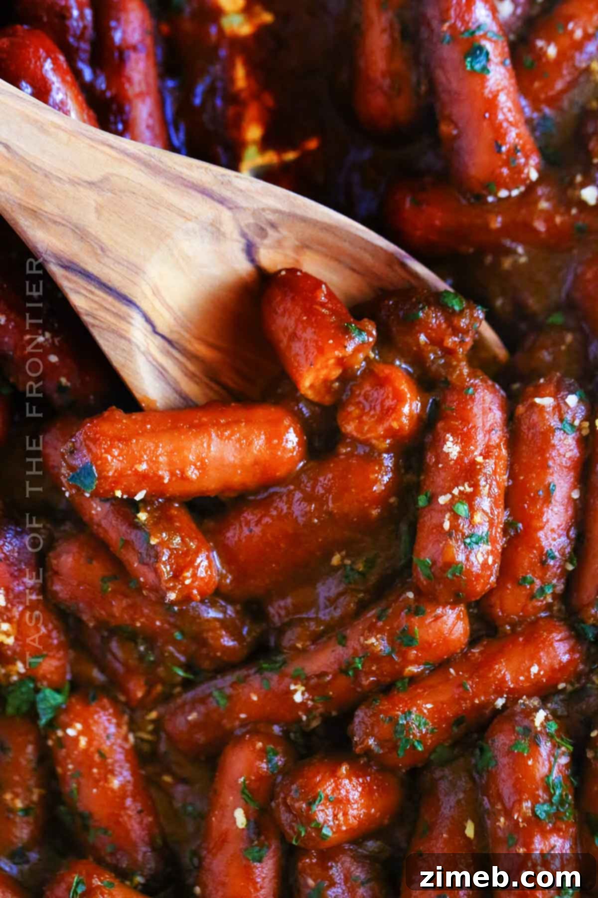 Smoky Sausage Bites 2 Smoked Little Smokies in BBQ sauce, glistening with sweet and tangy sauce