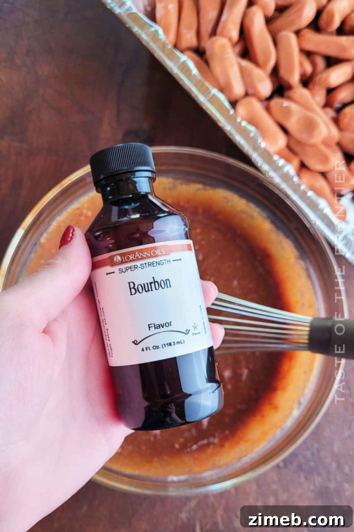 Smoky Sausage Bites 7 Adding bourbon flavoring to the BBQ sauce mixture